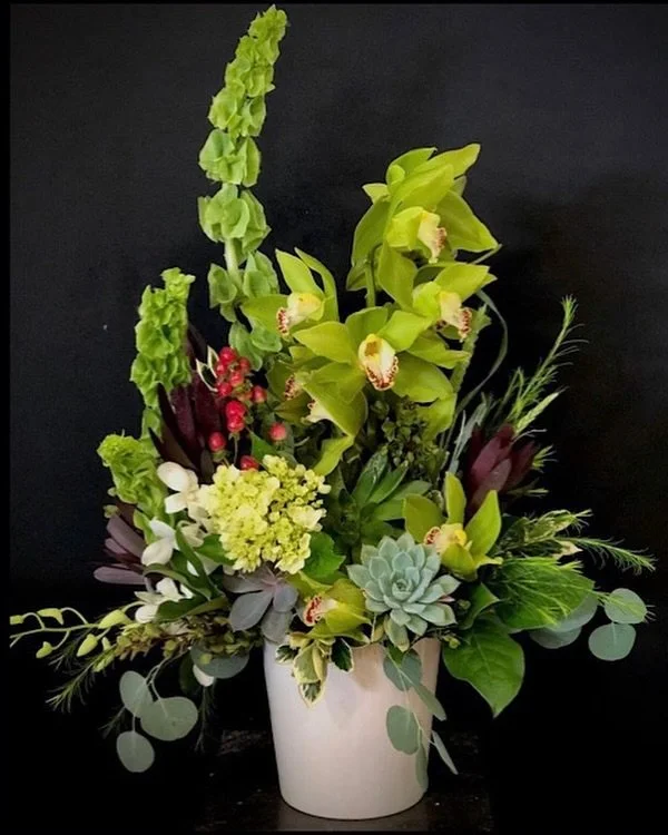 Love the green cymbidiums with the variety of foliage and other green flowers.
