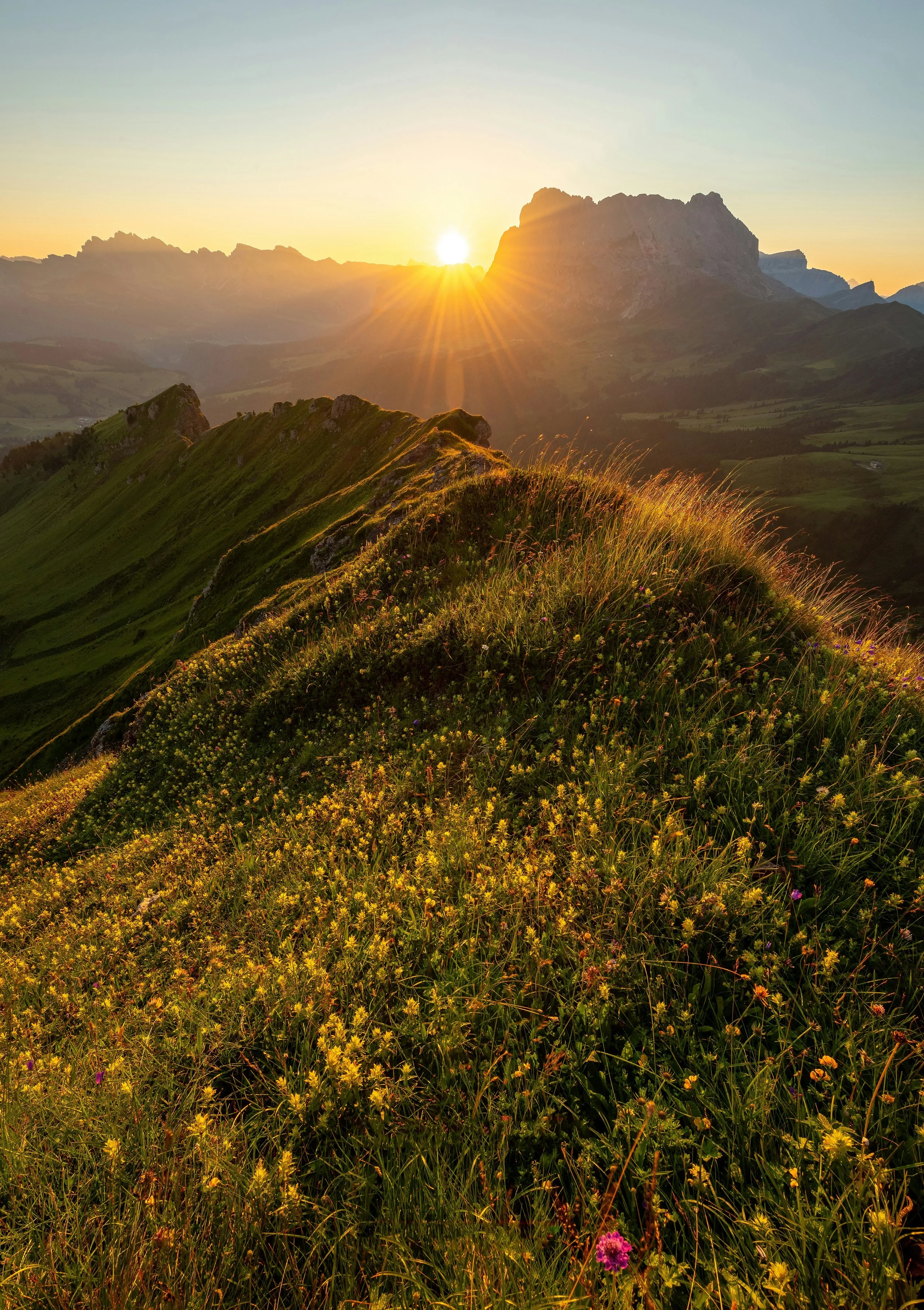 Golden hour over a mountain landscape — Aviarie family gear for parents who go places