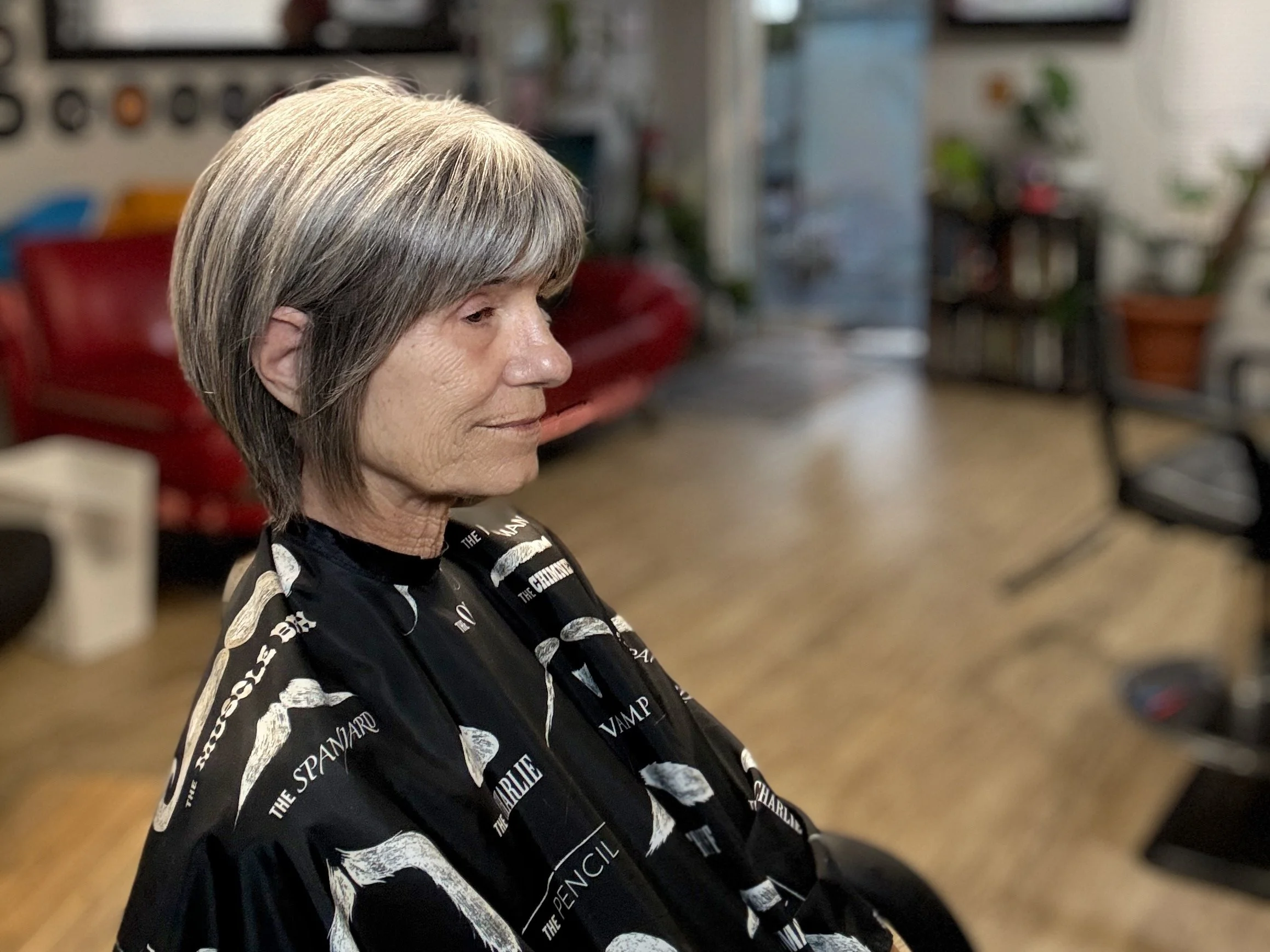 Short textured women’s haircut in New Port Richey shaped to grow out clean and require minimal styling