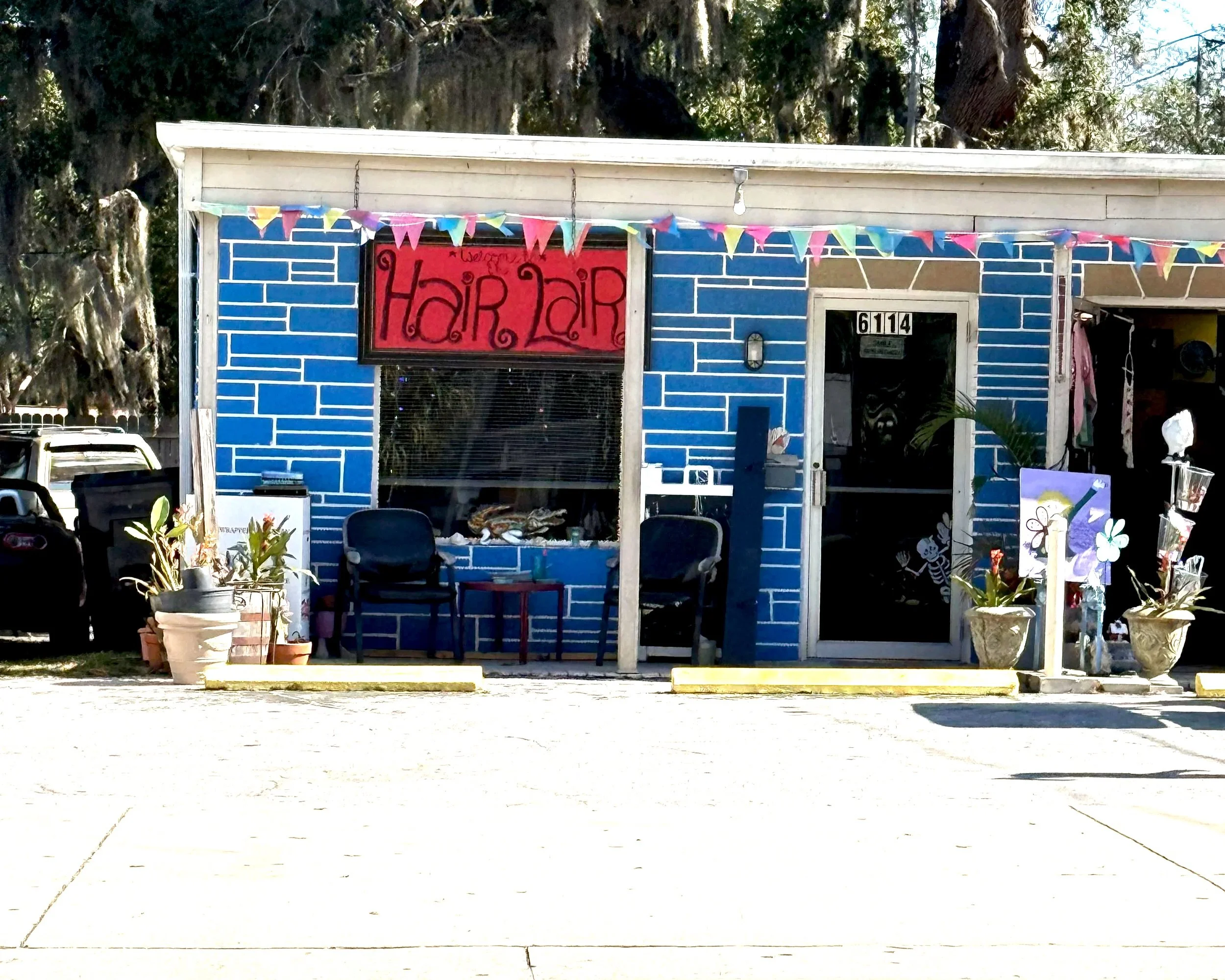 Exterior of NPR Hair Lair in downtown New Port Richey, Florida, where Snip Happens operates as a one-on-one hair studio.