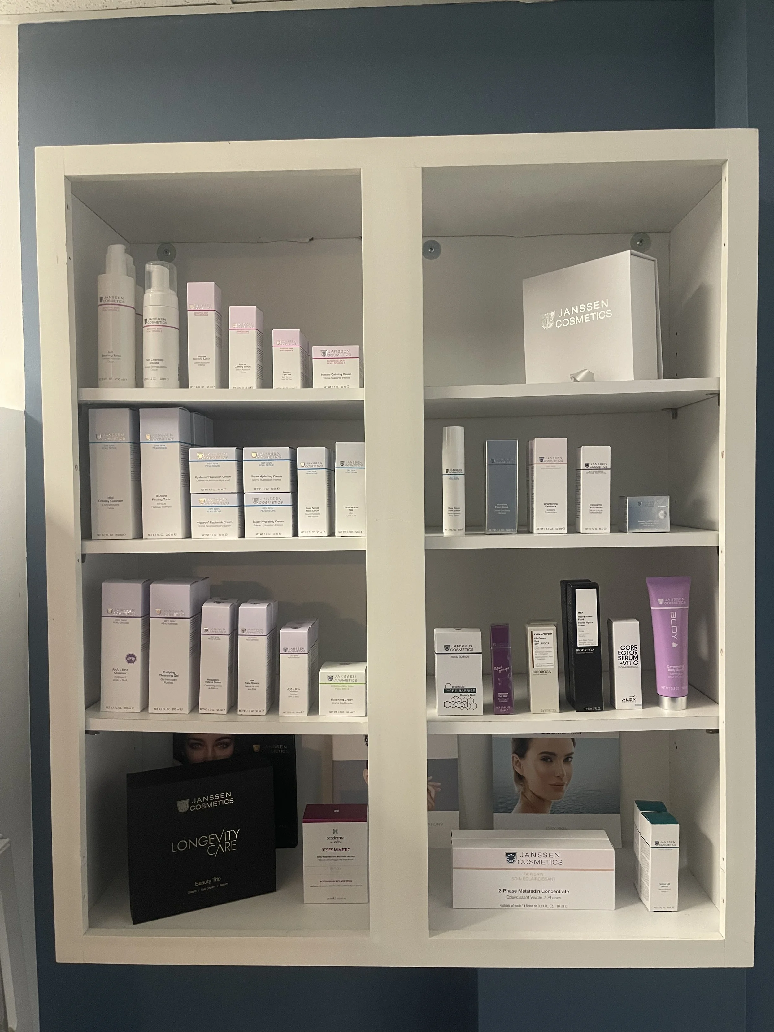 Professional skincare products display featuring Dermaki and Janssen Cosmetics including cleansers serums moisturizers and anti aging treatments used by esthetician in Wheaton, IL for healthy glowing skin and advanced facial care