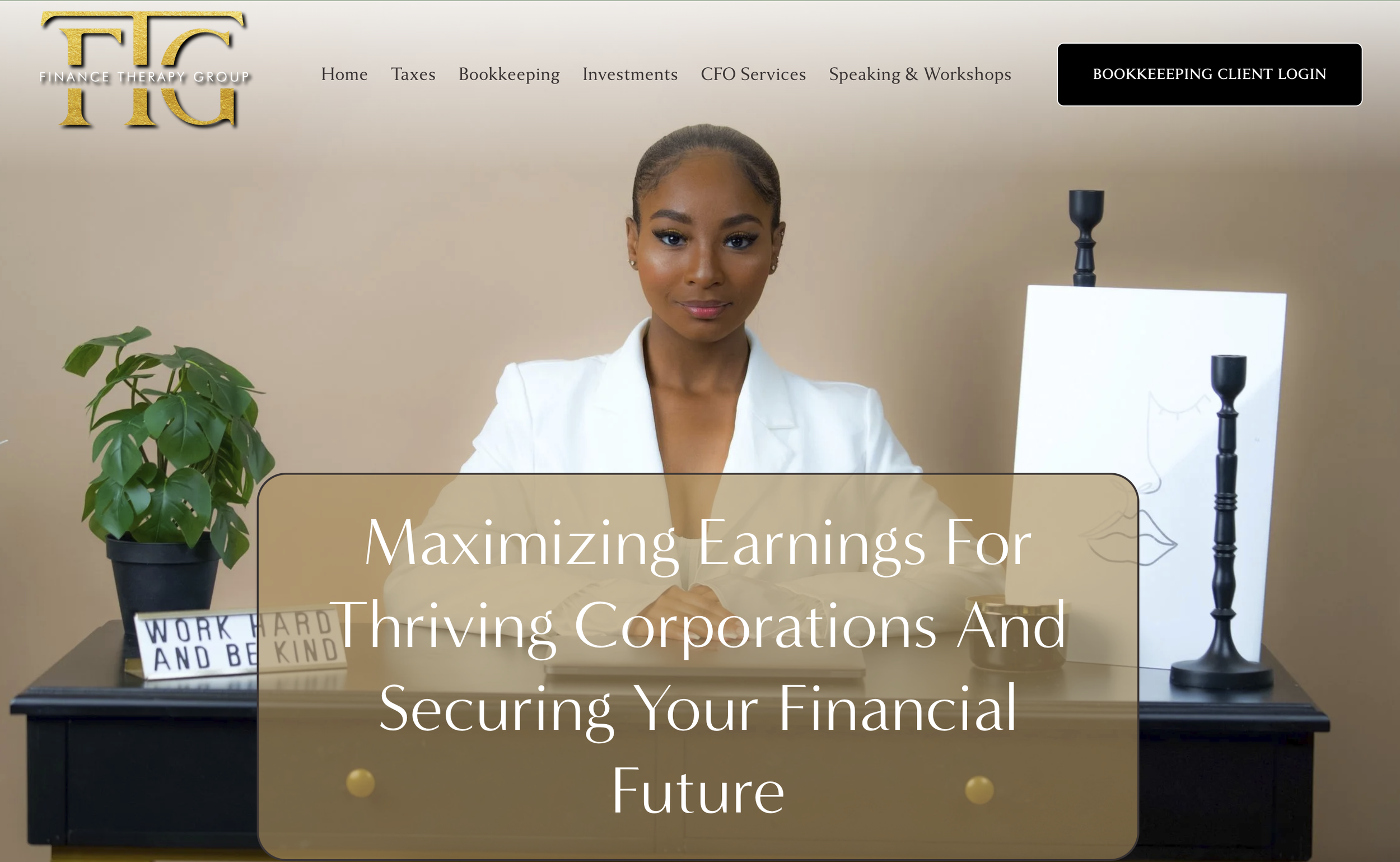 A woman sitting at a desk with a plant and motivational sign, smiling at the camera, for a finance or bookkeeping service website.