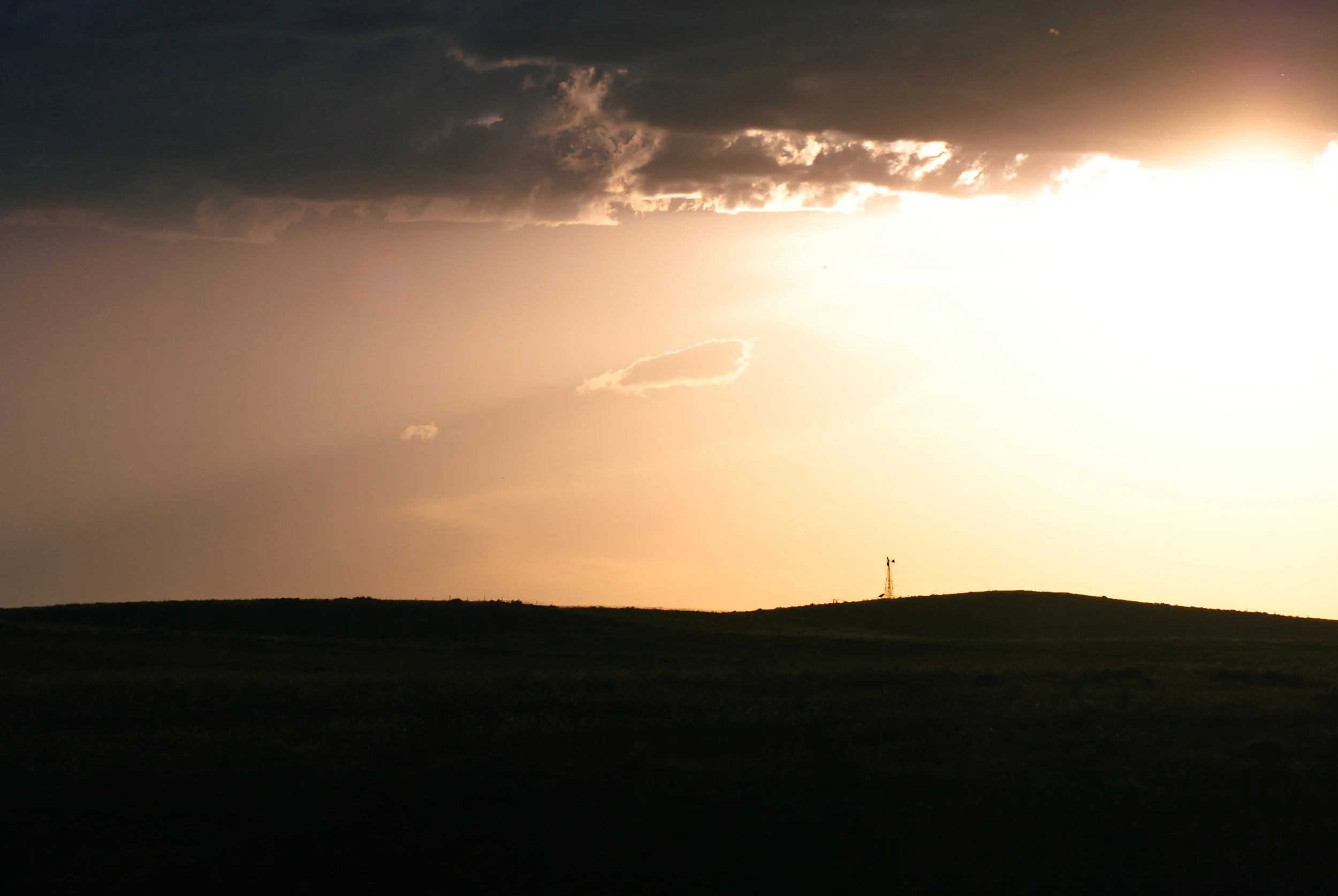 A Windmill Silhouetted on a Hill