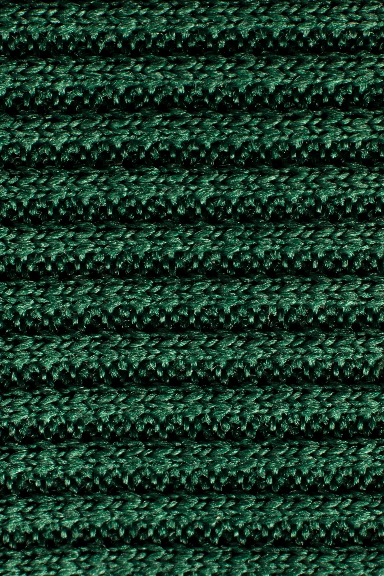 Texture de tresses en fil d'une couleur vert foncé.