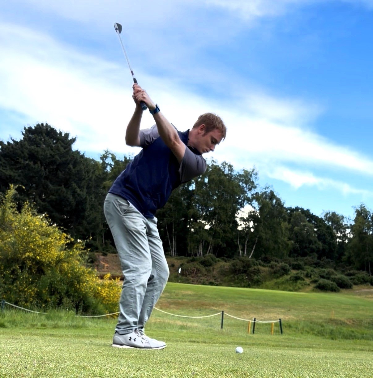 Ali Hall hitting a wedge shot into the 2nd hole on the Heath course at Woodbridge Golf Club in Suffolk.