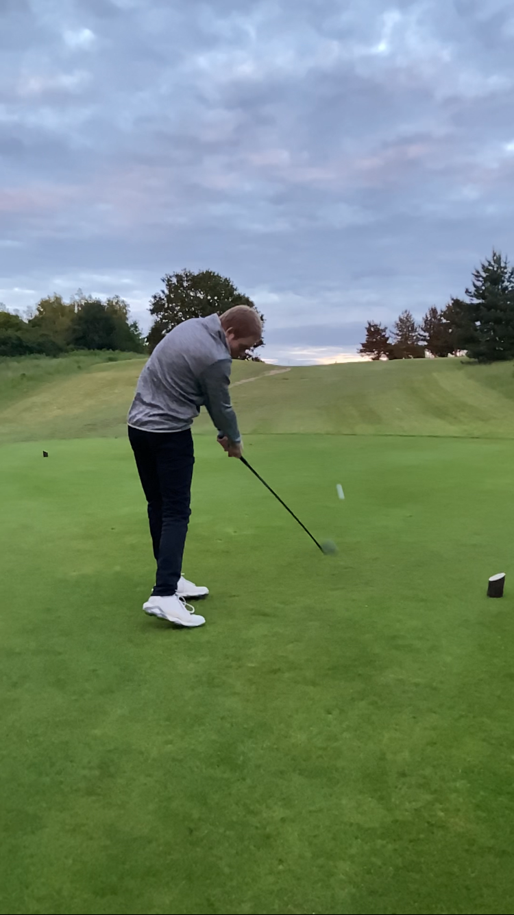 Ali Hall teeing off on 5th Hole at Halesworth Golf Club with a fairway wood.