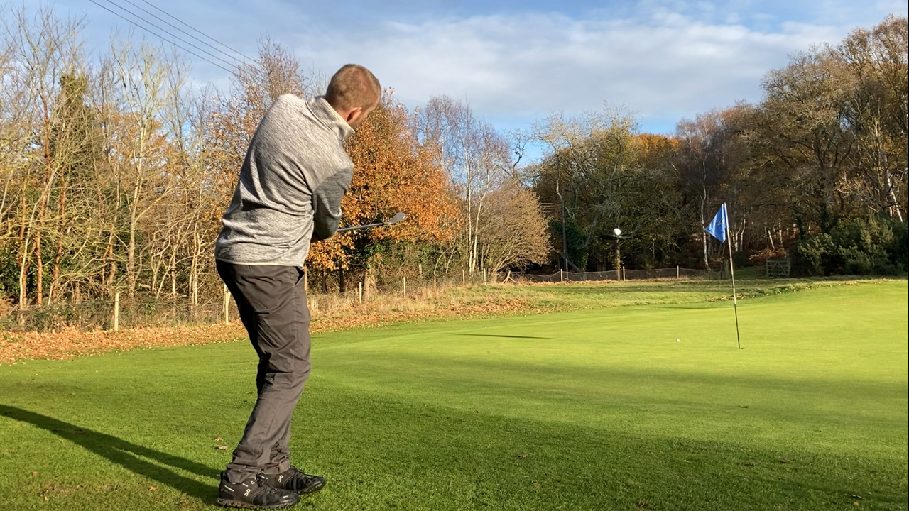 Ali Hall chipping balls on the short game area in Autumn at Woodbridge Golf Club. Perfect area for short game lessons including chipping, pitching and bunkers.