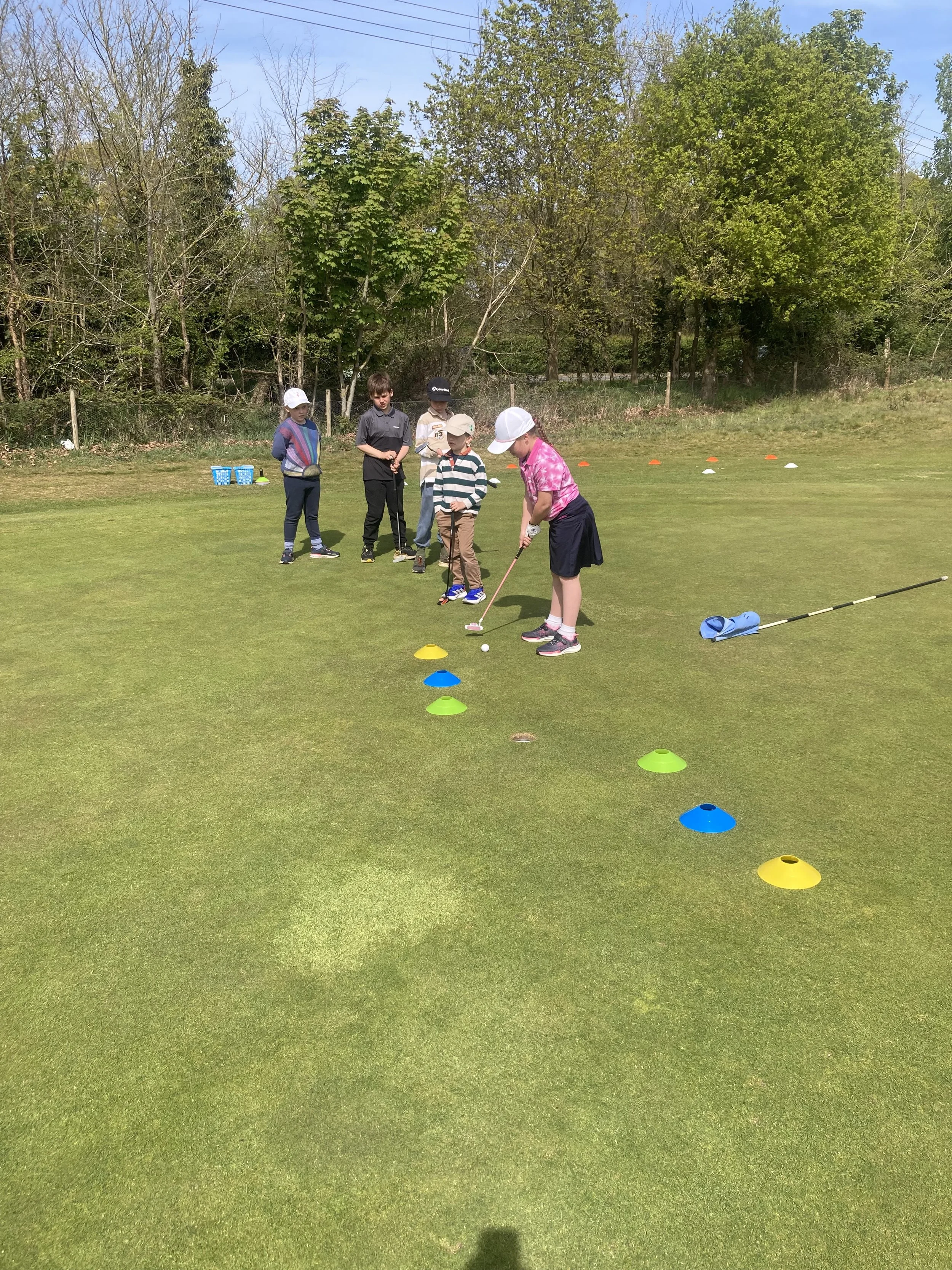 Junior coaching sessions at Woodbridge Golf Club. All set up with colorful cones and golf equipment.