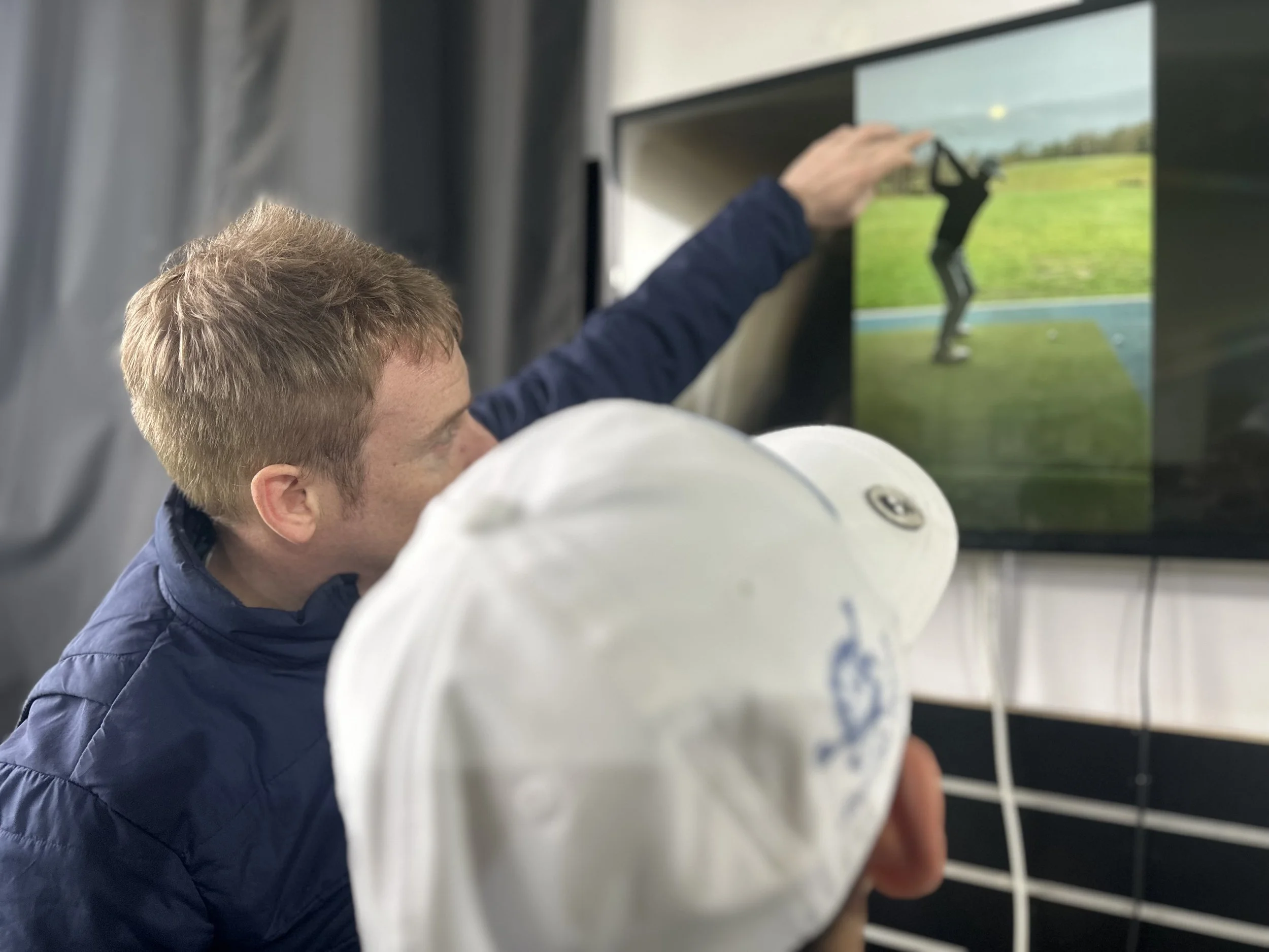 Video analysis in a golf lesson with PGA Professional Ali Hall at Woodbridge Golf Club, Suffolk.