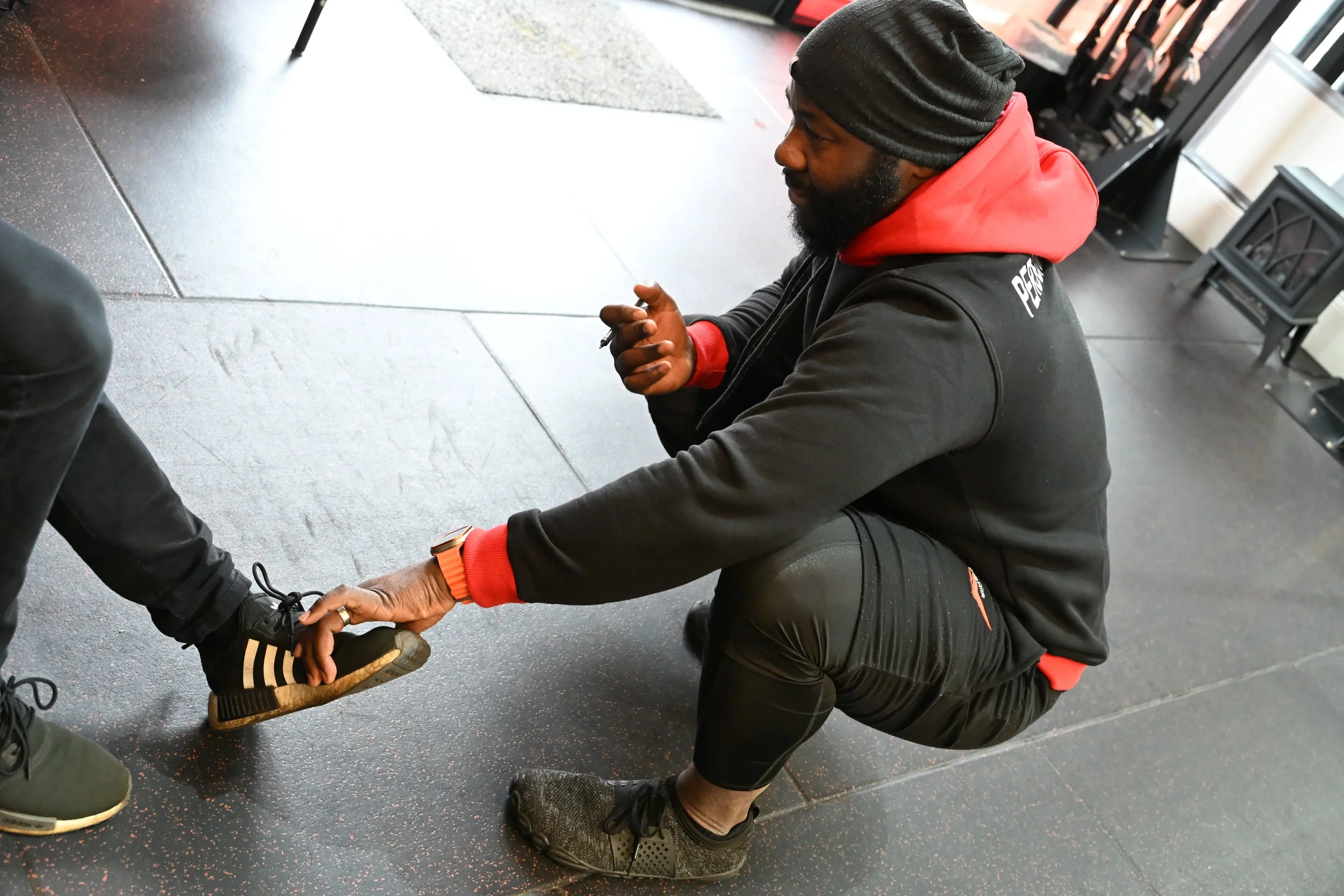 TrainRite founder, Emmanuel, doing a personal assessment with a client.