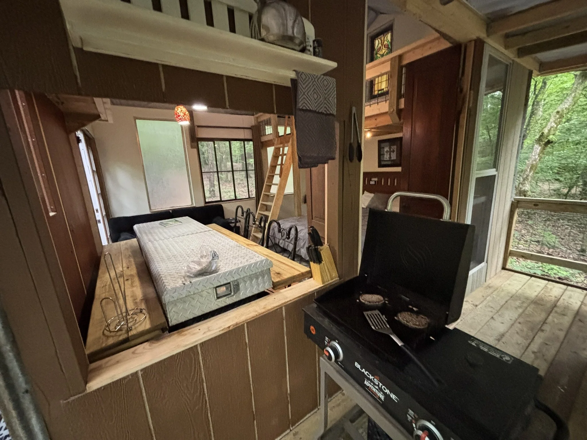 Cooking facility with window pass-through to inside dining room