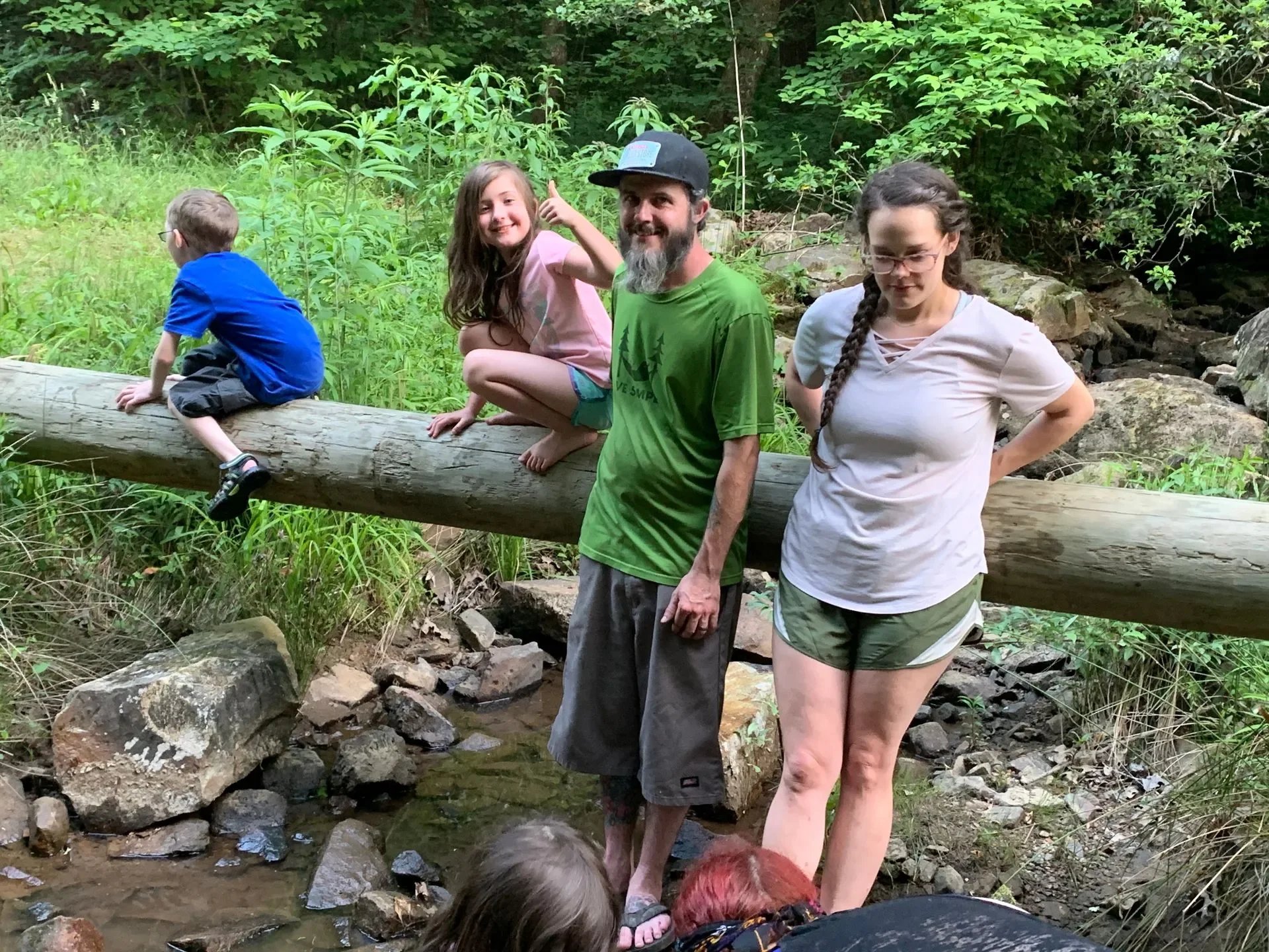 Playing on the Log across the creek