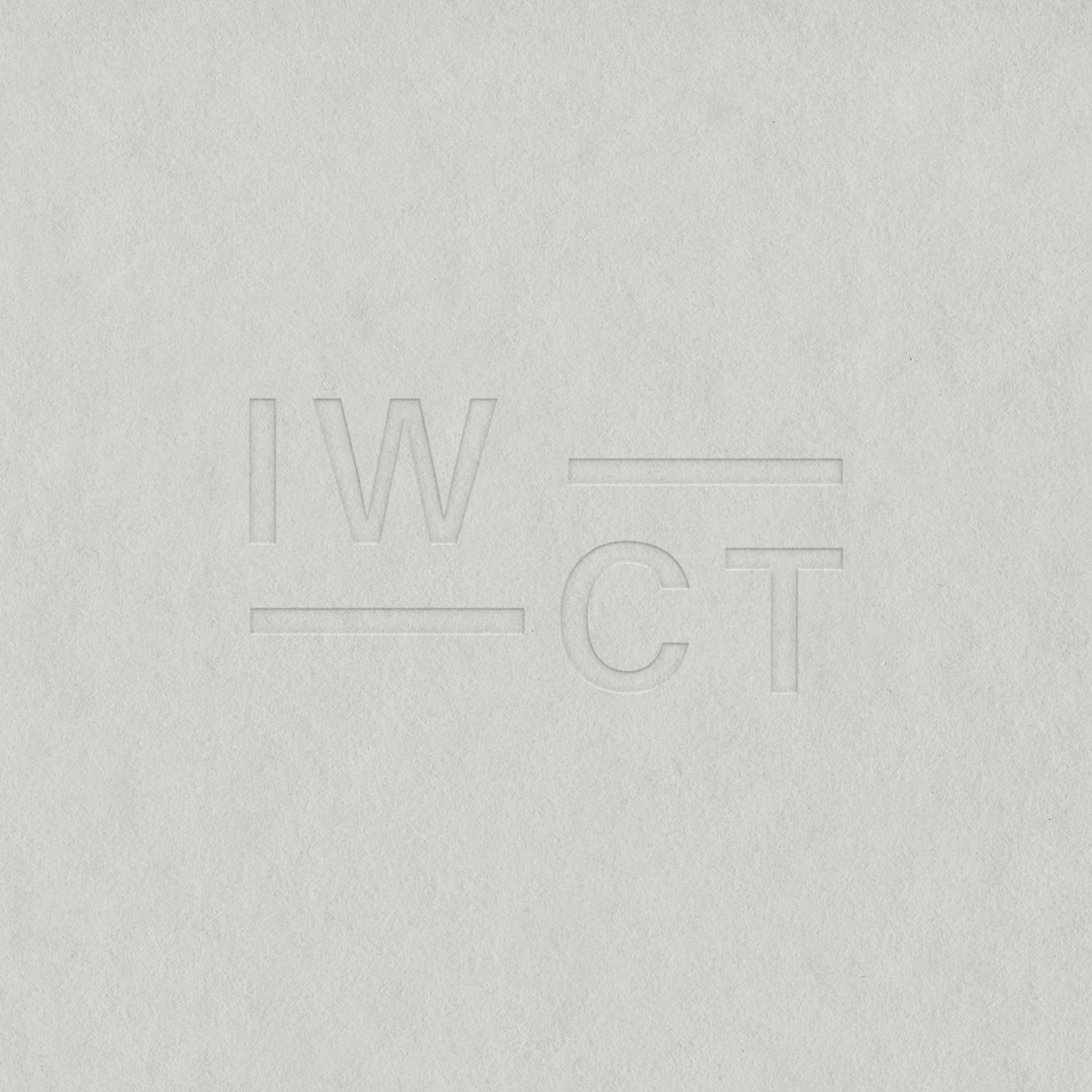 Embossed text on white paper reading 'IW' on the left and 'CT' on the right, with lines above and below of the letters.
