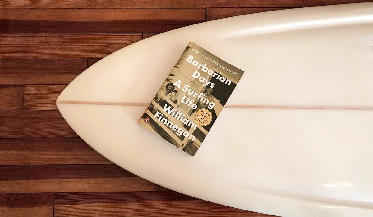 Copy of “Barbarian Days” by William Finnegan placed on a surfboard, referencing surf literature and personal connection to the ocean. Featured on UNU Boutique Hotel’s inspiration page in Ahangama, Sri Lanka.