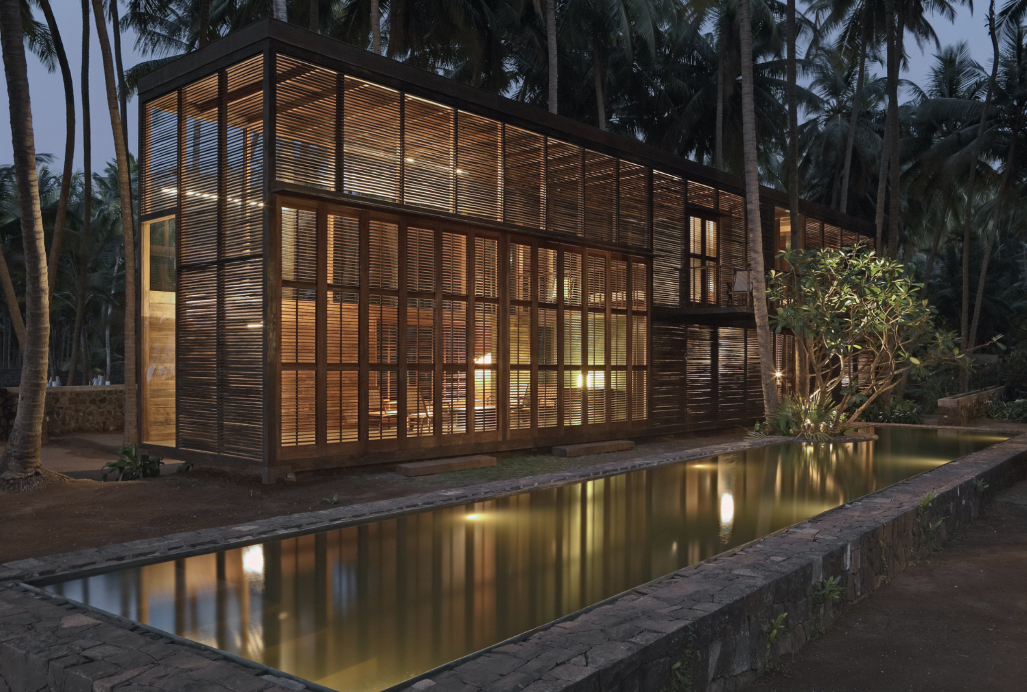 Palmyra House  set among palm trees, reflecting a calm, material-led approach to tropical architecture. We loved this vibe and it was a genuine inspiration for UNU Boutique Hotel