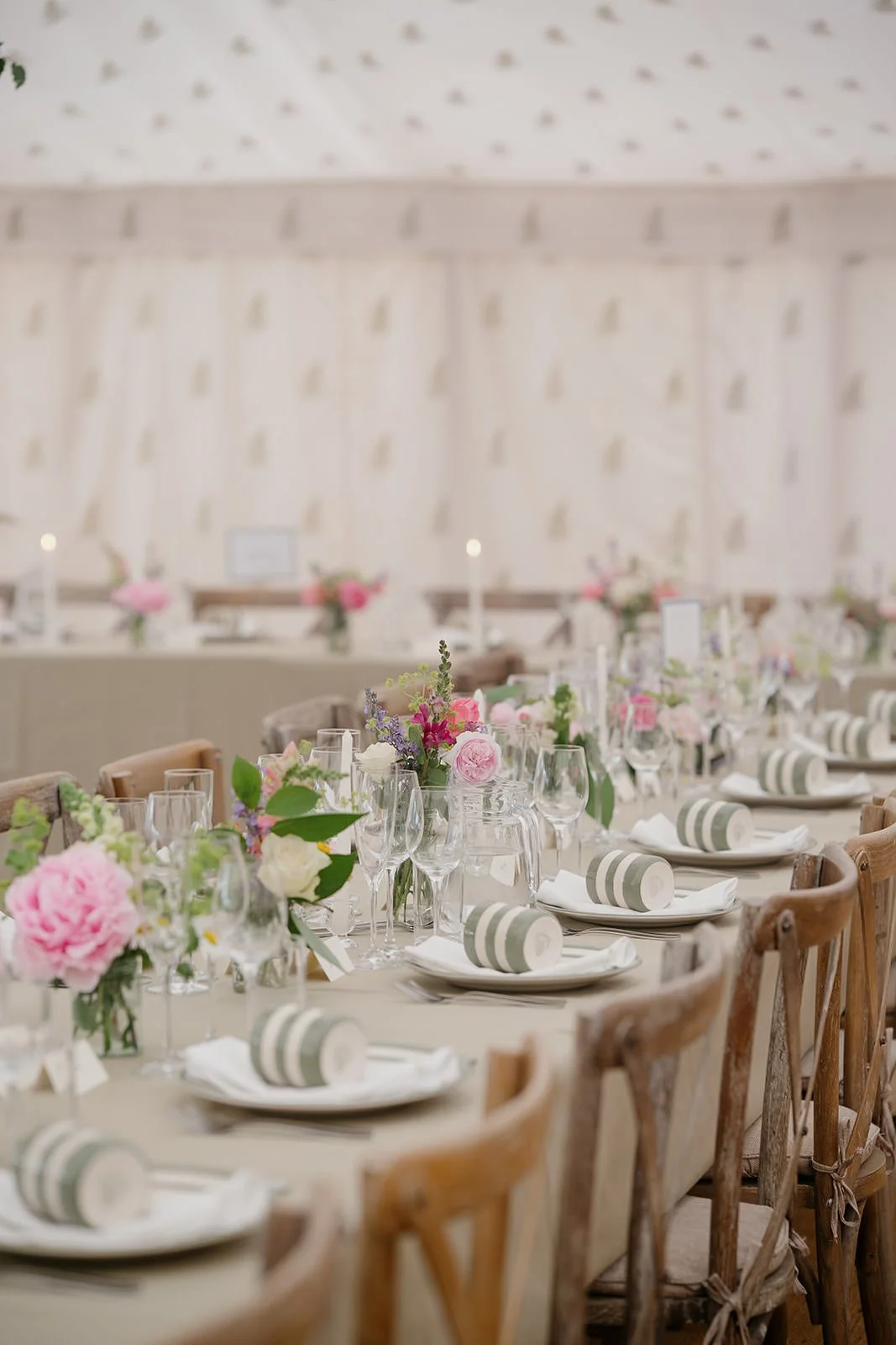 Elegant banquet table with pink and white flowers.