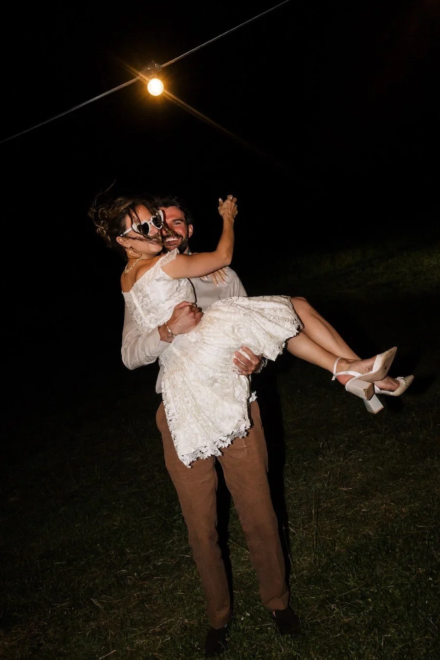 Celebrating the wedding with fun embrace.