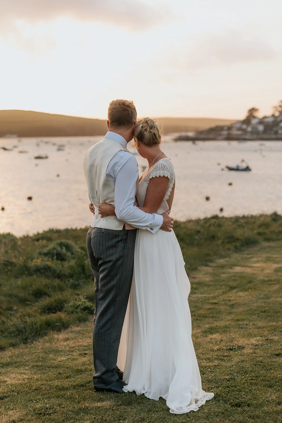 Bride and Groom looking at Rock, Cornwall view