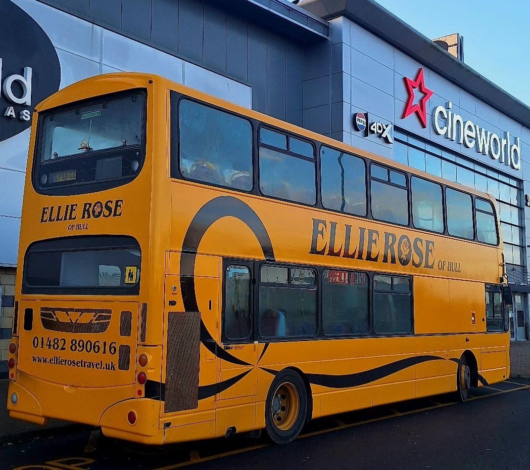 Yellow double-decker bus with branding for Ellie Rose of Hull, parked outside a Cineworld movie theater.