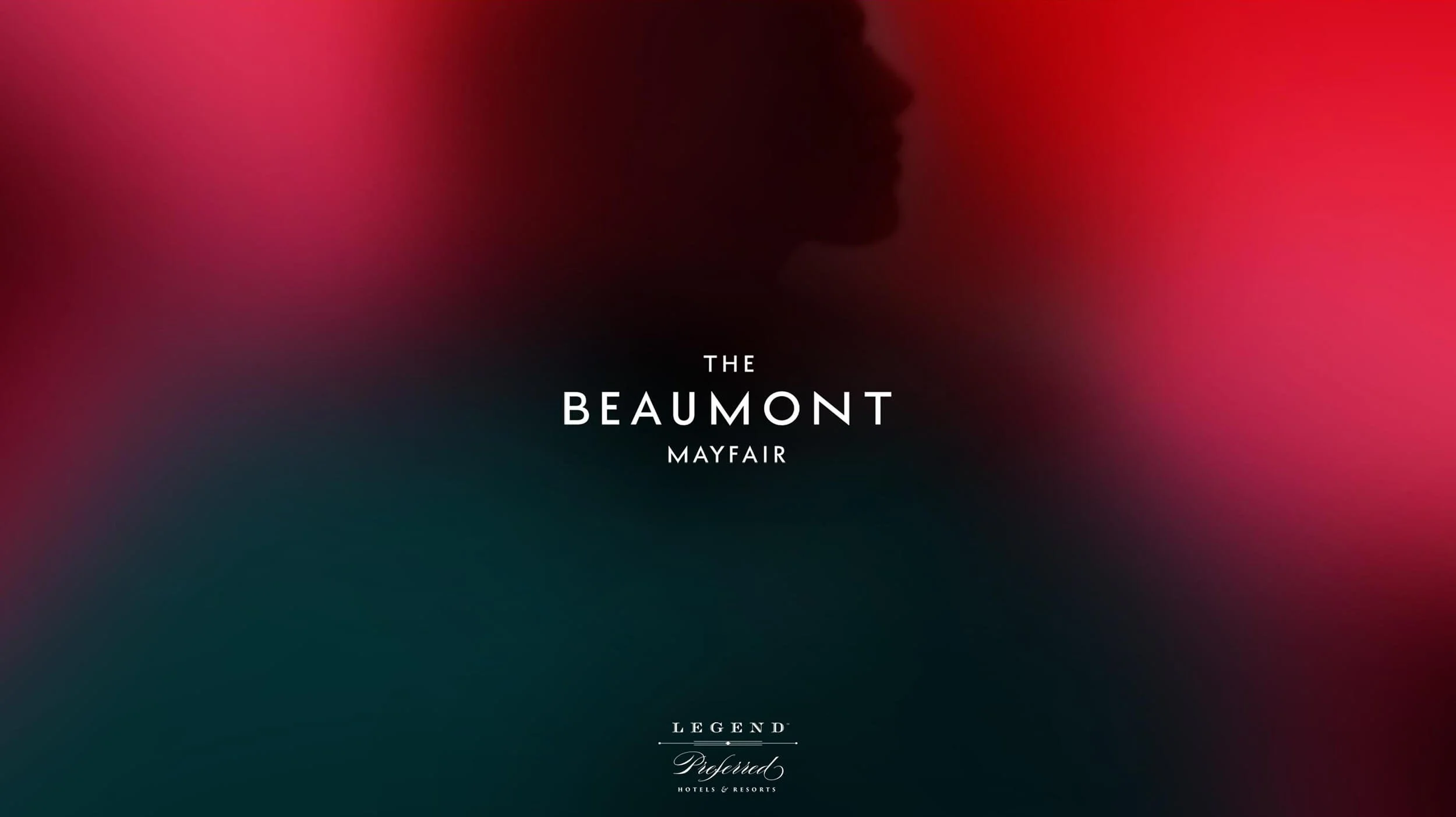 Silhouette of a person's profile against a colorful blurred background with text 'The Beaumont Mayfair' and 'Legend Pioneered Hotels & Resorts'