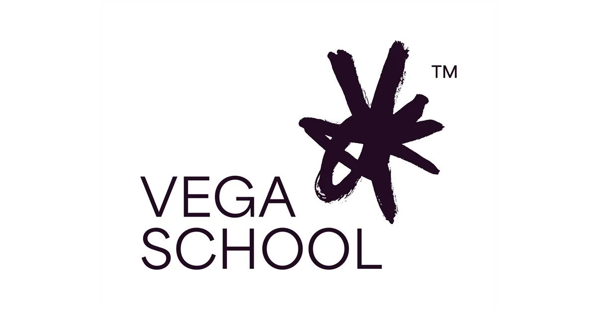 Vega School logo with a purple star-shaped symbol and the words "Vega School" in purple text.