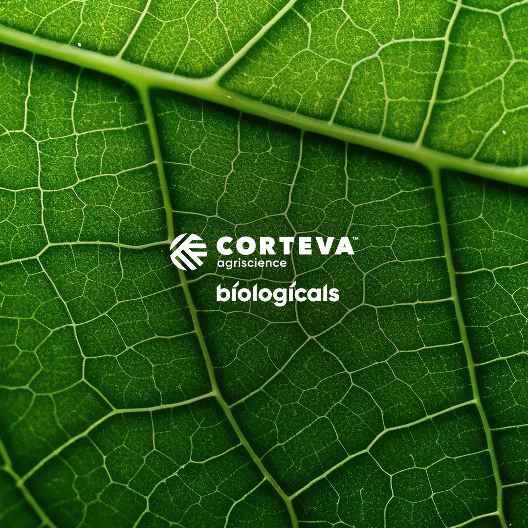 Close-up of green leaf with visible veins, overlaid with white text and logo for Corteva Agriscience Biologicals.