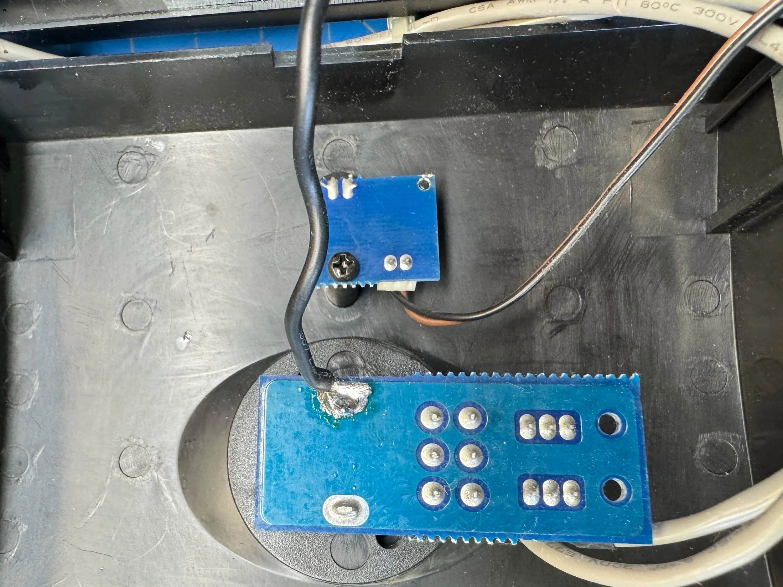Rear of the Jamo MPA-101 volume control showing the ground wire that is temporarily disconnected for power supply board removal.
