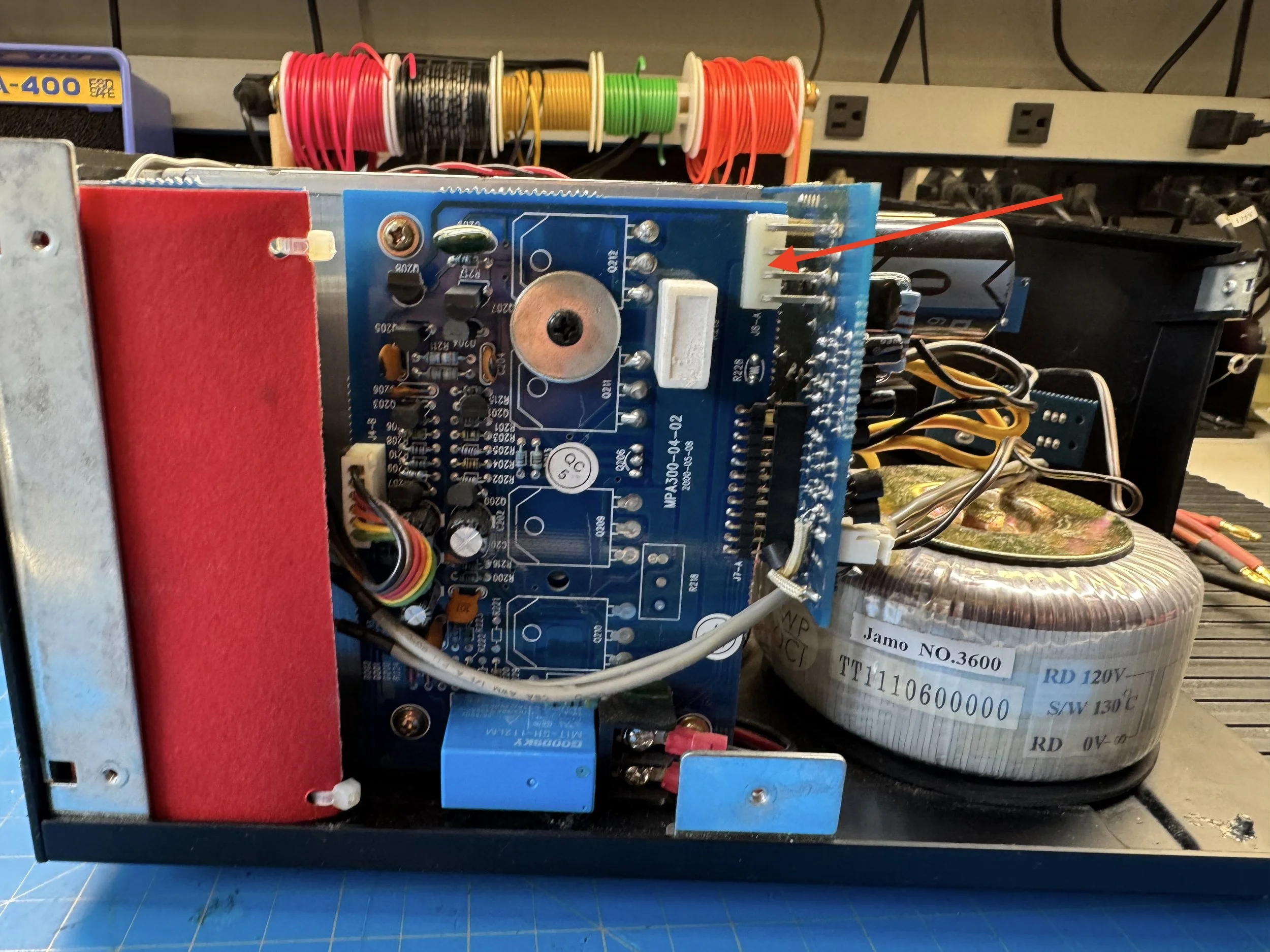 Second edge connector securing the Jamo MPA-101 power supply board during disassembly.