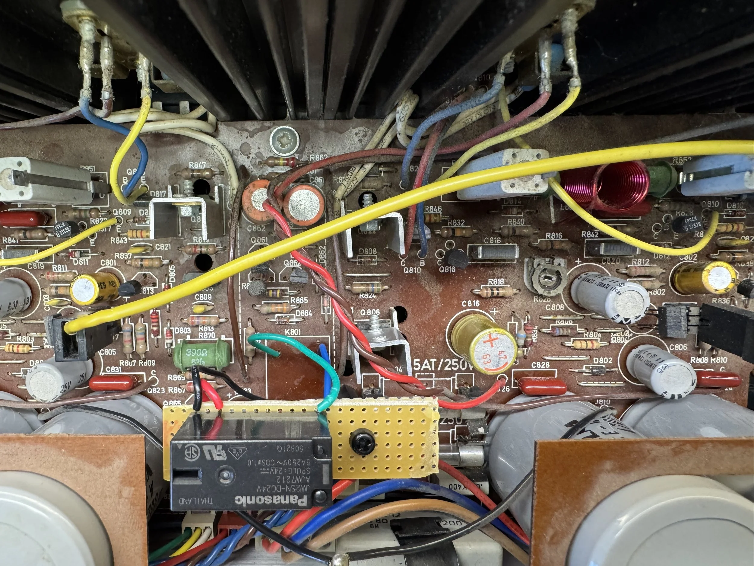 A photo showing where a speaker protecting relay board is installed in a Tandberg TR-2055 receiver