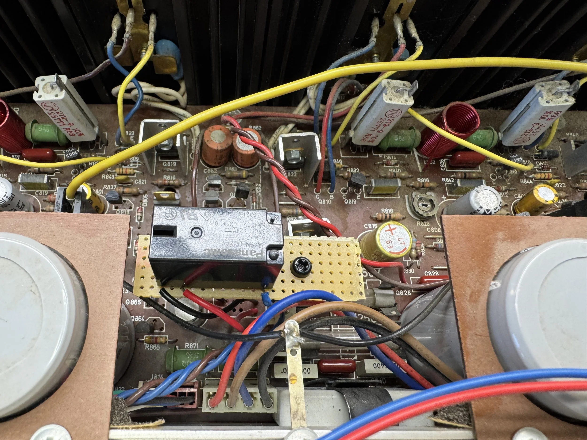 A photo showing where a speaker protecting relay board is installed in a Tandberg TR-2055 receiver