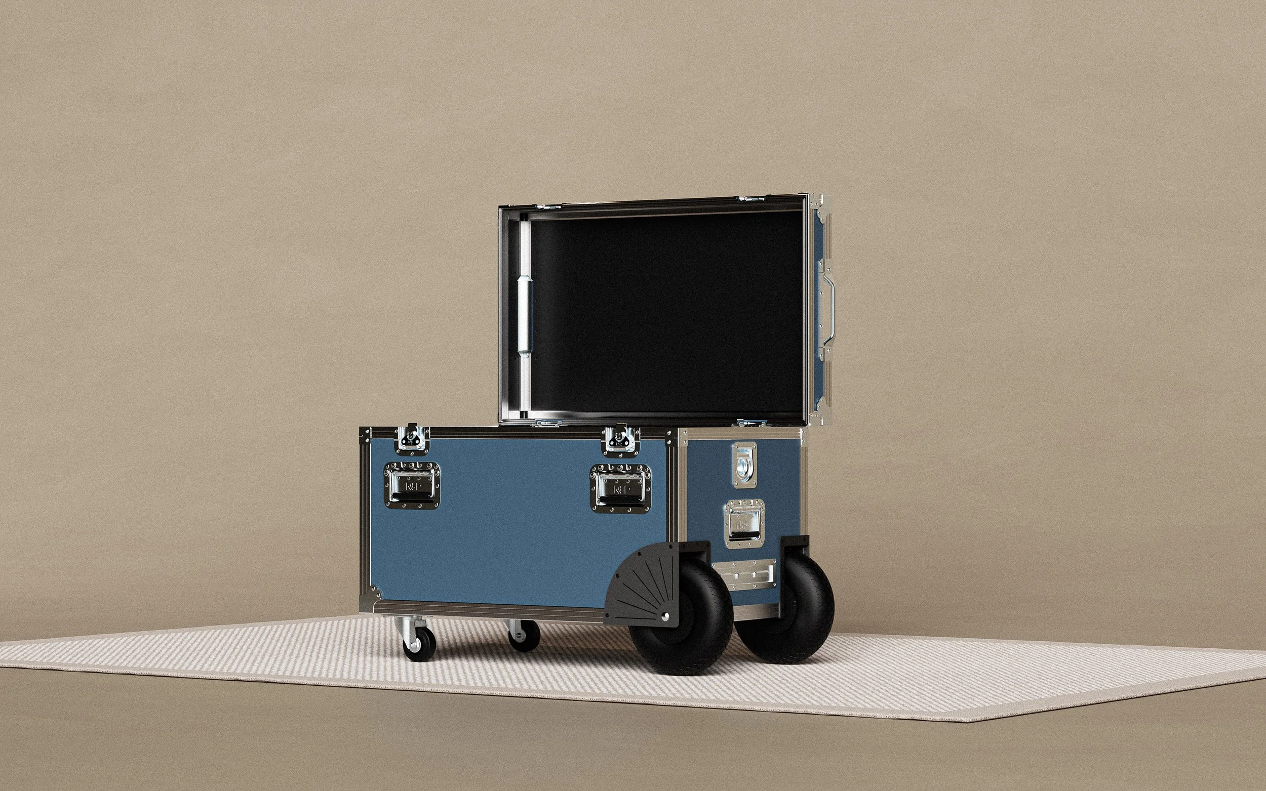 A blue flight case with black wheels, open on the top, set on a textured beige surface against a beige background.