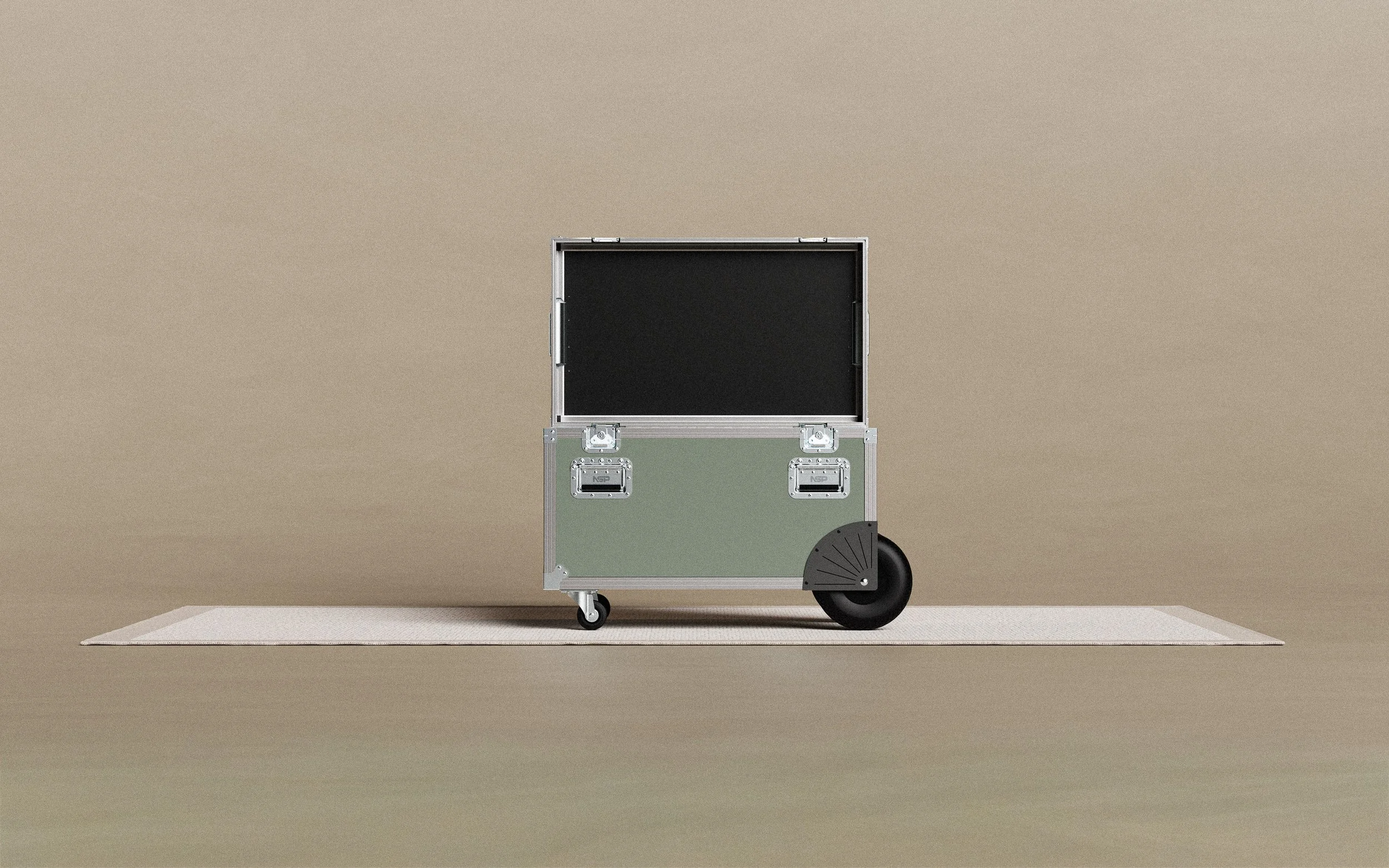 A silver and green equipment cart on a beige rug against a beige wall, with black wheels and handles.