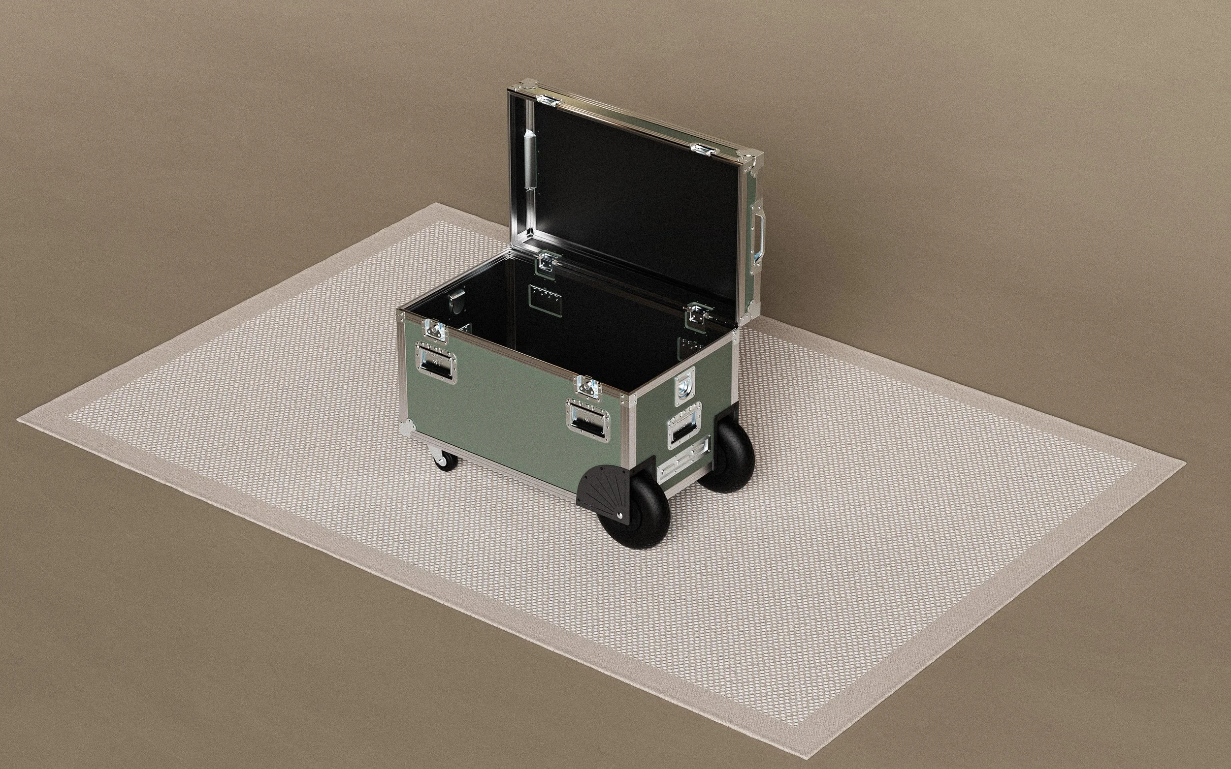 Open black and green equipment case on a beige surface with a white textured mat.