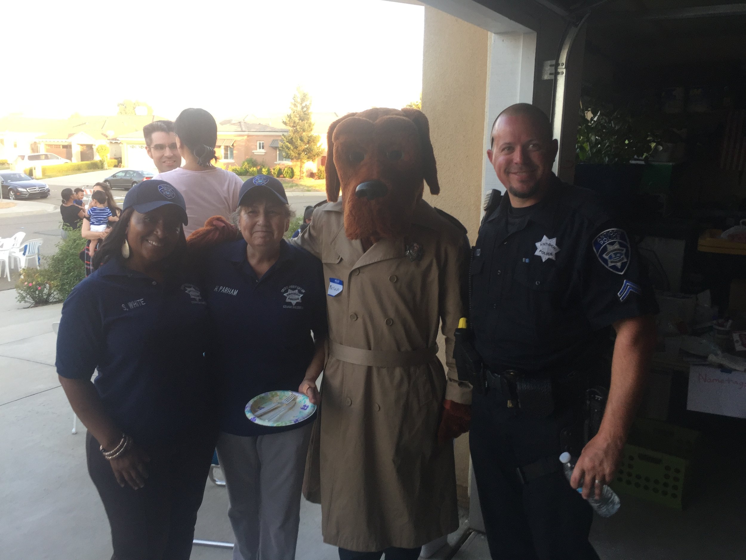 Sandra White serving as the former Chairman of the Antioch Crime Prevention Commission with McGruff the Crime Dog and Antioch Police Officers.