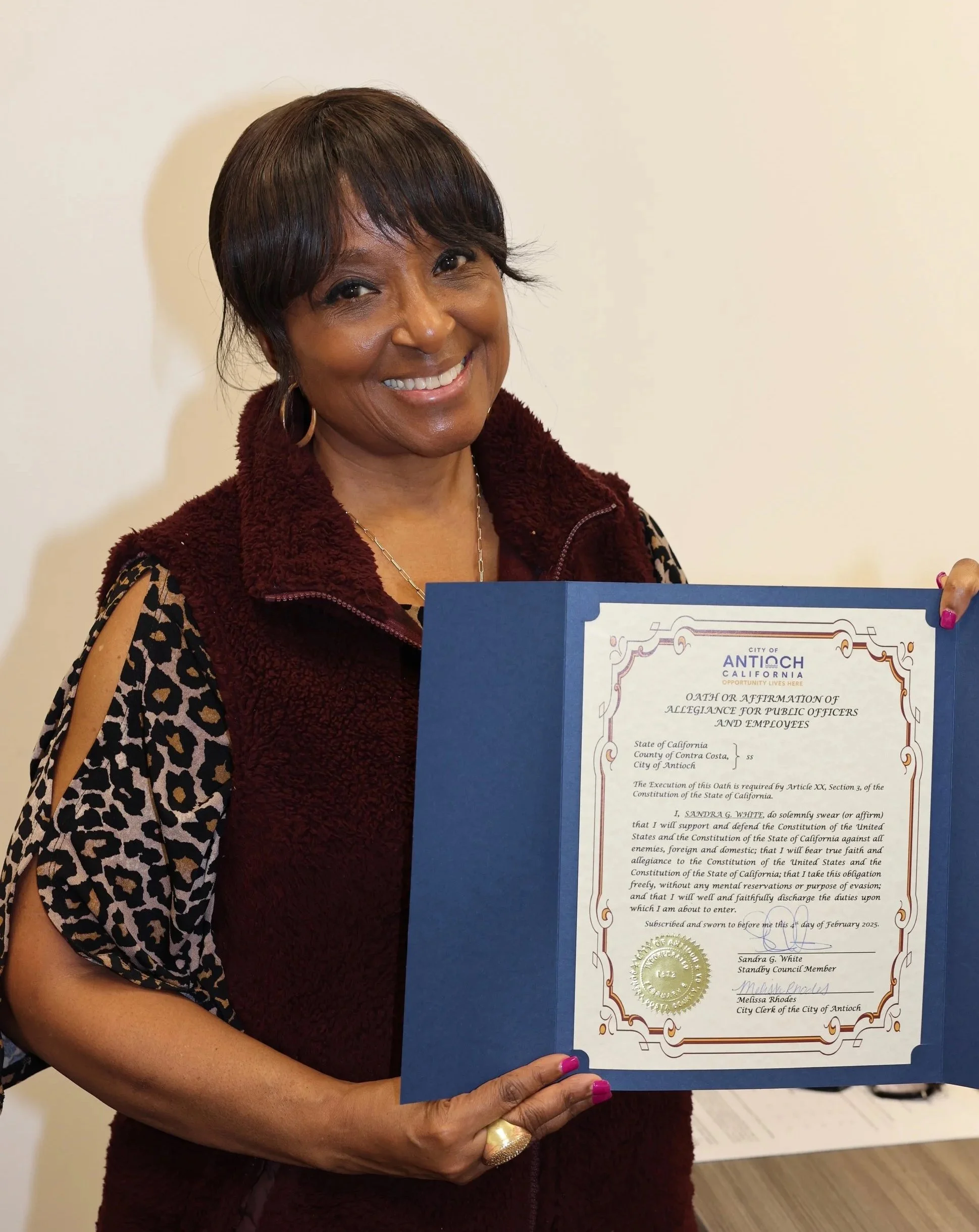 Sandra White holding a certificate of oath or affirmation from the city of Antioch, California.as a stand by council member.