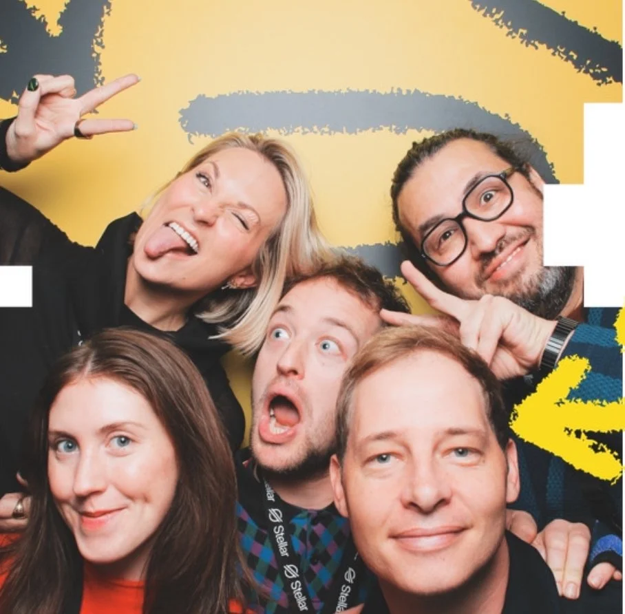 Creative team group of people making silly faces into camera