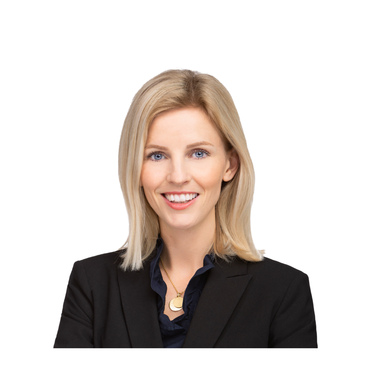 Confident blonde woman in black blazer with arms crossed, smiling against a plain background.
