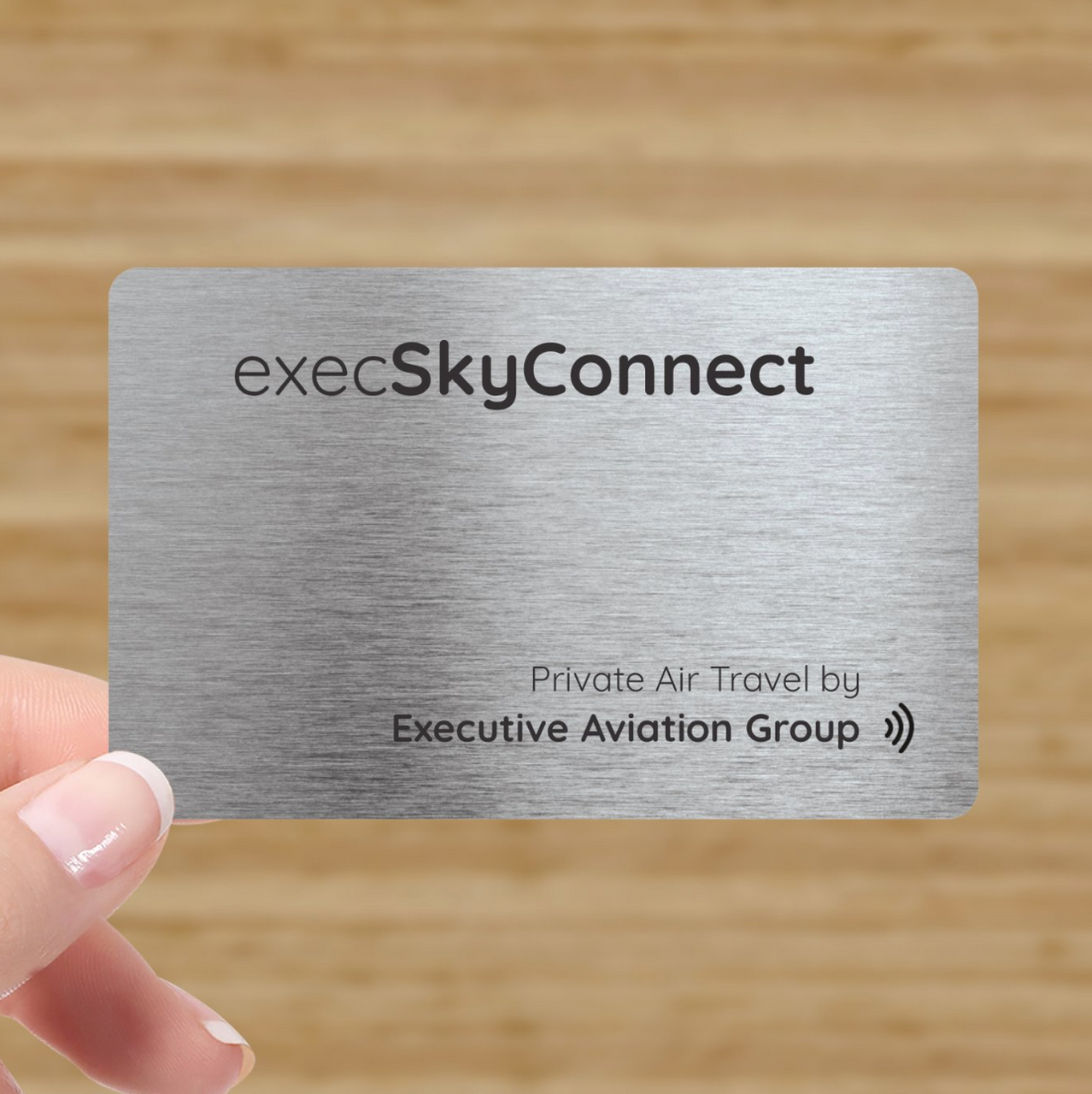 Metal card for executive air travel, labeled 'execSkyConnect' and 'Private Air Travel by Executive Aviation Group'.