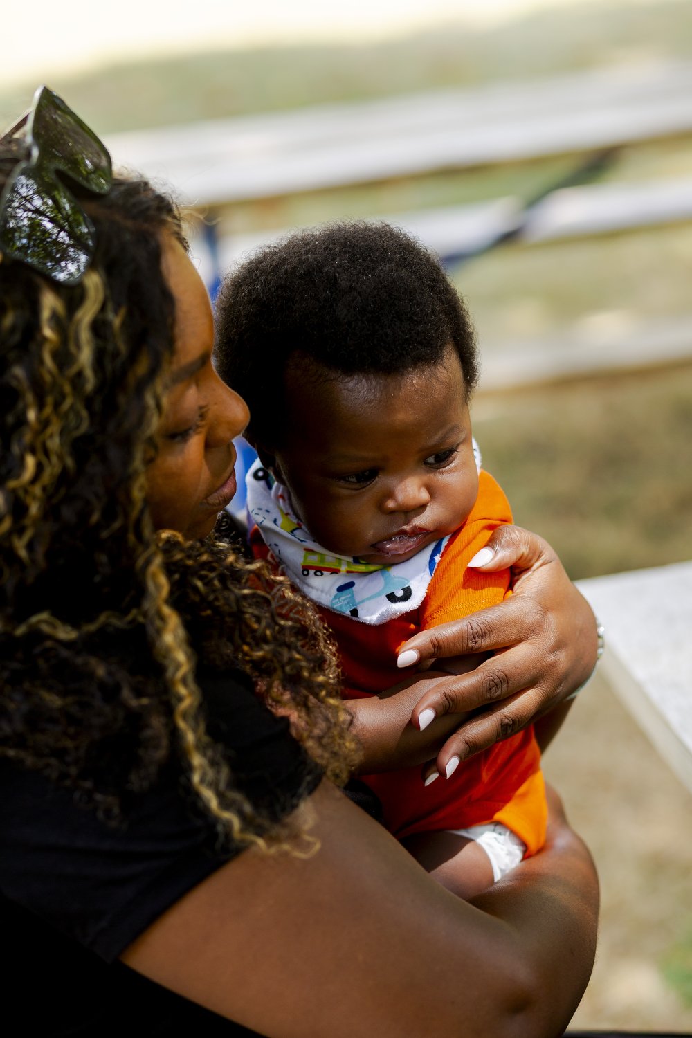 Bree Stallings, certified doula, at postpartum visit, Detroit, MI holding baby