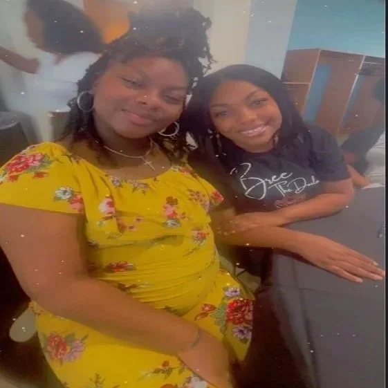Bree sitting with a client smiling