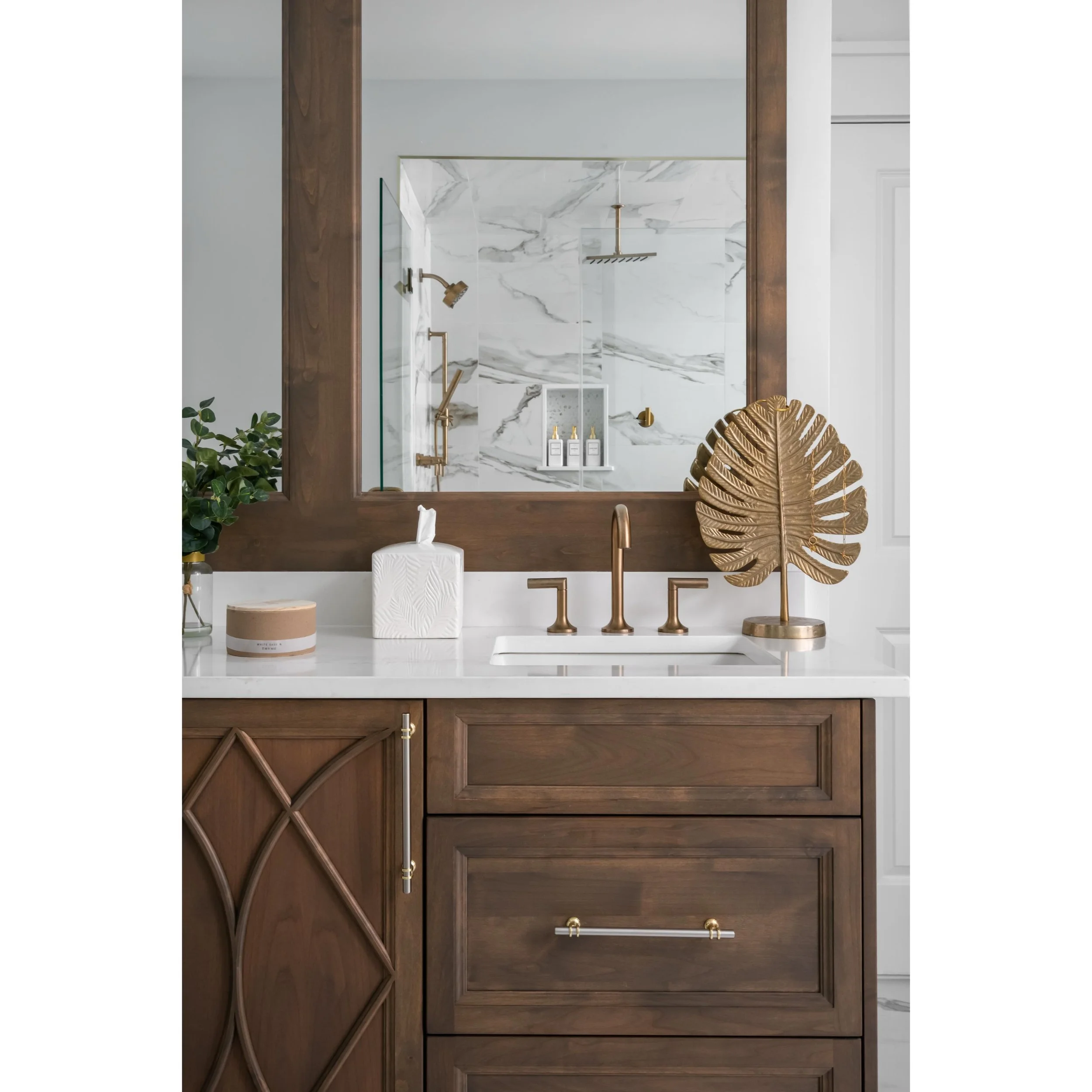 Custom details in these stand out bathrooms.

Warm walnut tones, soft brass details, and clean marble textures &mdash; the kind of bathroom that instantly feels calm.

Loved capturing the balance of contrast and simplicity in this space.

Designed fo