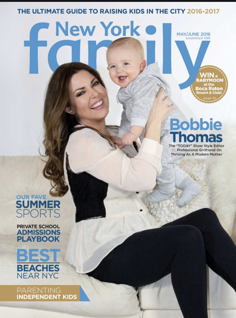 A woman holding a smiling baby boy on her lap, sitting on a white sofa, on the cover of New York Family magazine, May/June 2016 issue.