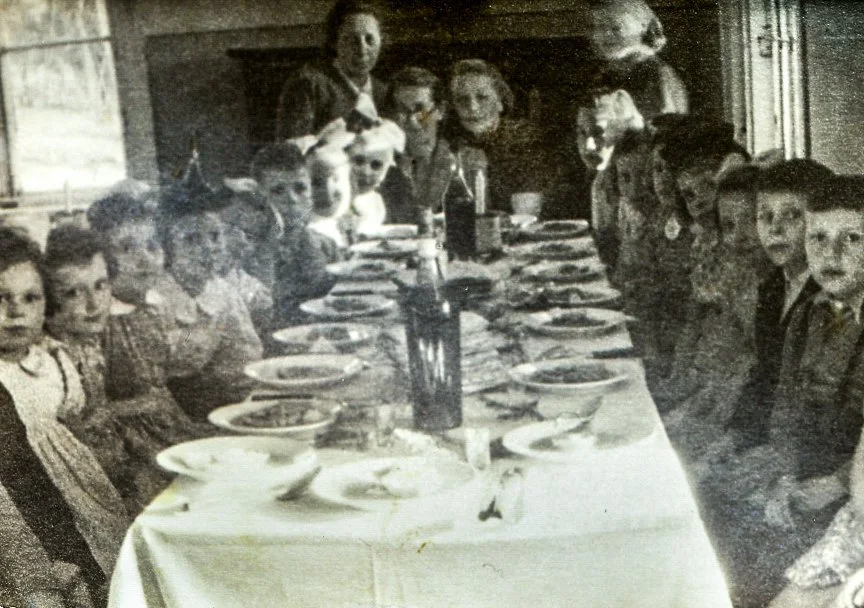 The orphanage in Poland my father lived at after the war. My grandmother is seen at the head of the table.  He recalls, "The kids were very mean to me there because I had a mother and they did not. They used to beat me up all the time."