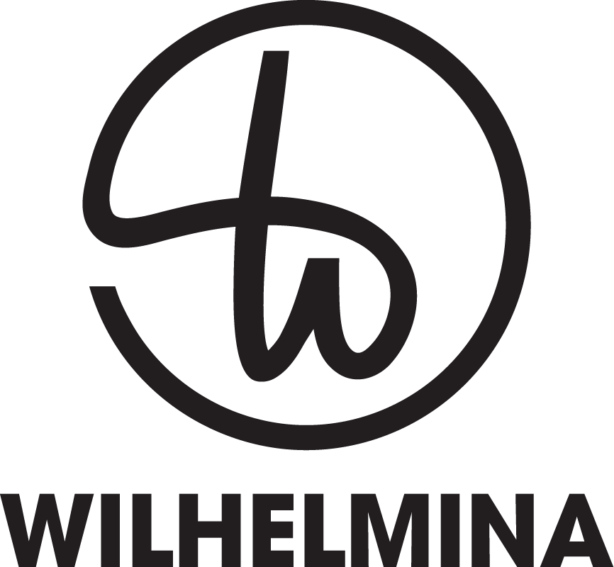 Black logo with circular design and stylized letters 'W' and 'L' inside, with the word 'WILHELMINA' underneath.