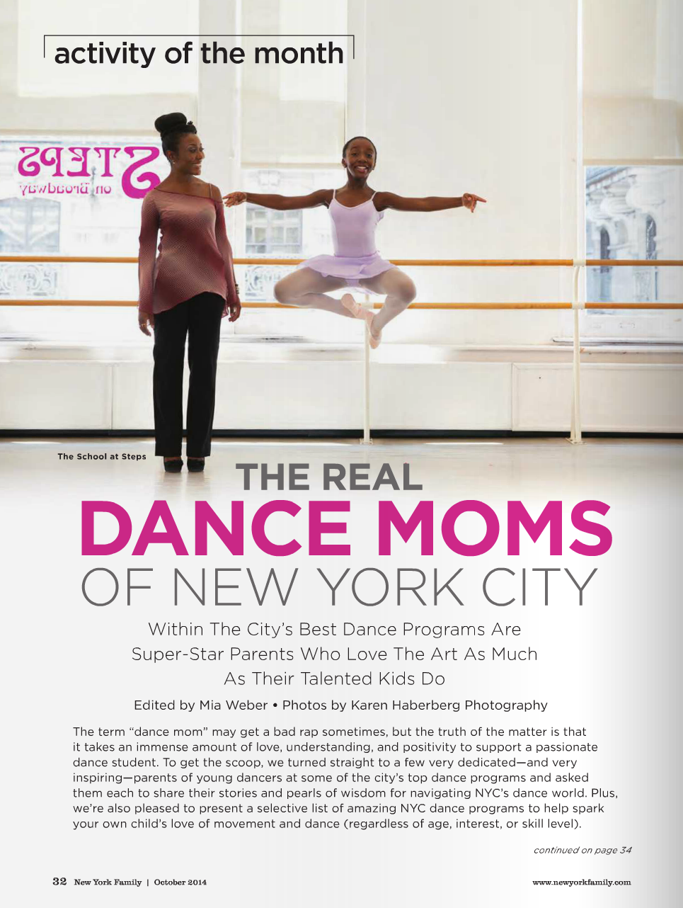 A young girl in a ballet outfit performs a jump at a dance studio with a woman observing. The studio has large windows, ballet bars, and city views outside.