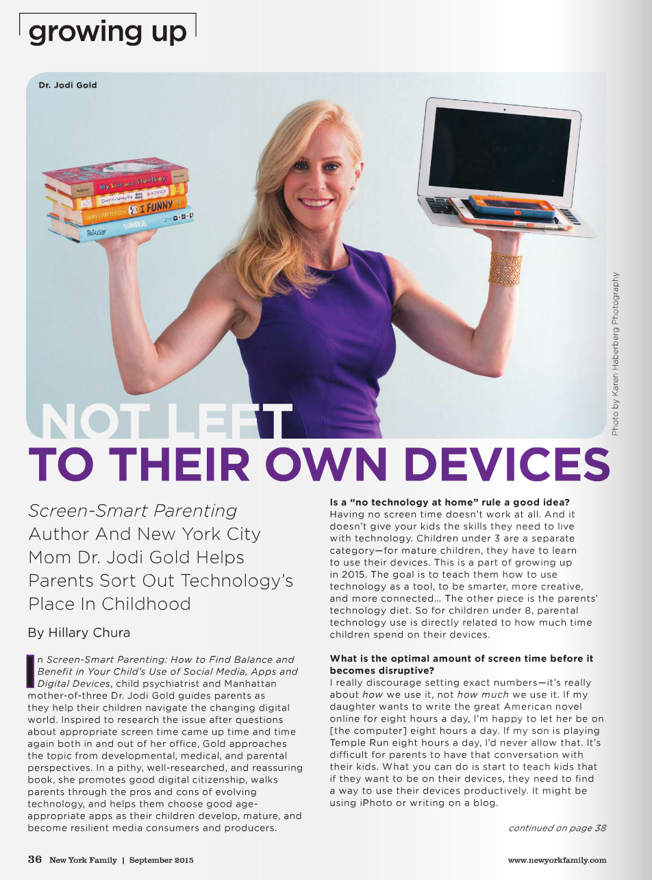 A woman with blonde hair, wearing a purple dress, holding a stack of books in one hand and a laptop with an orange smartphone on top in the other, standing against a light blue background.