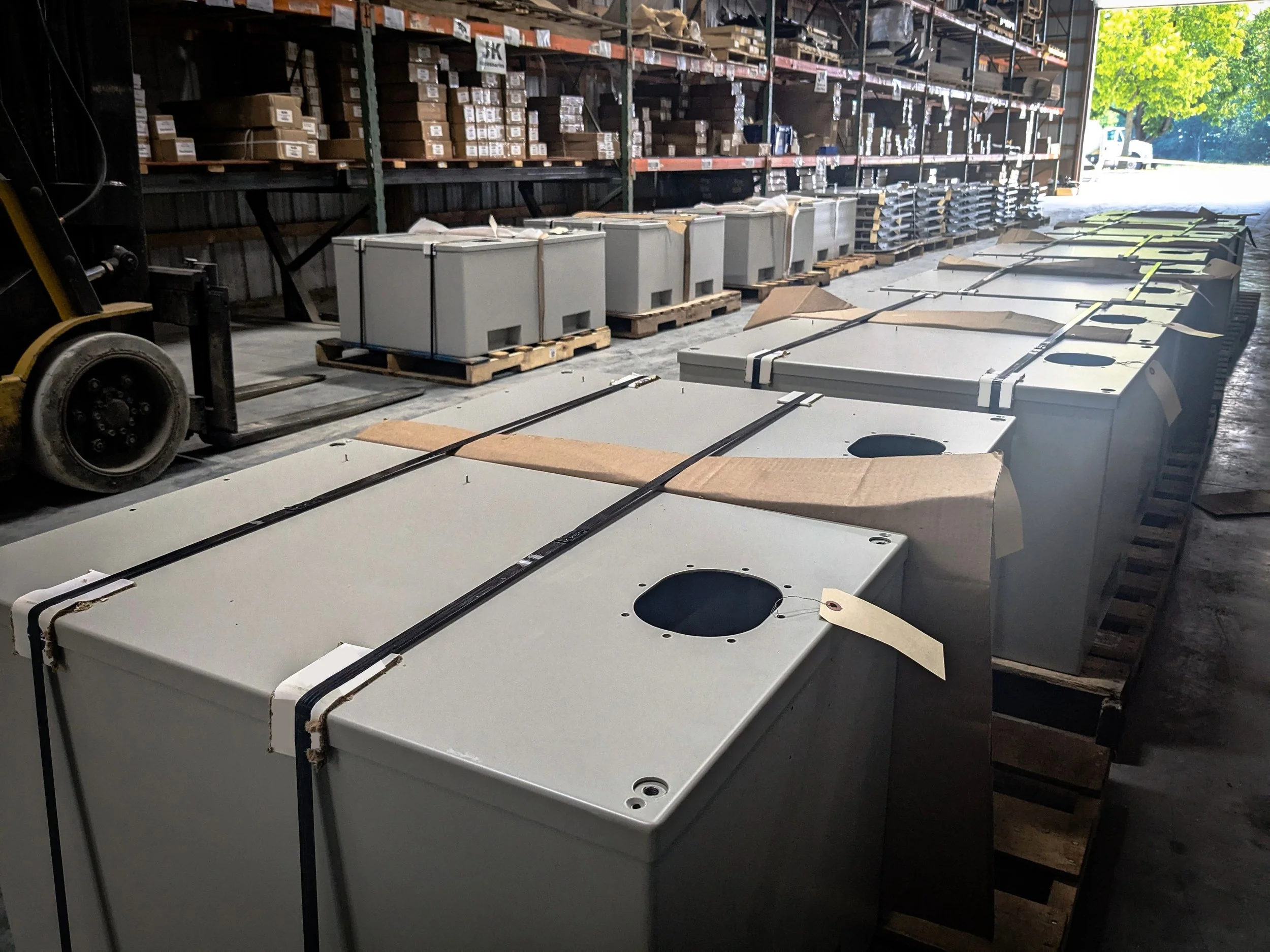 Large industrial warehouse with several metal objects