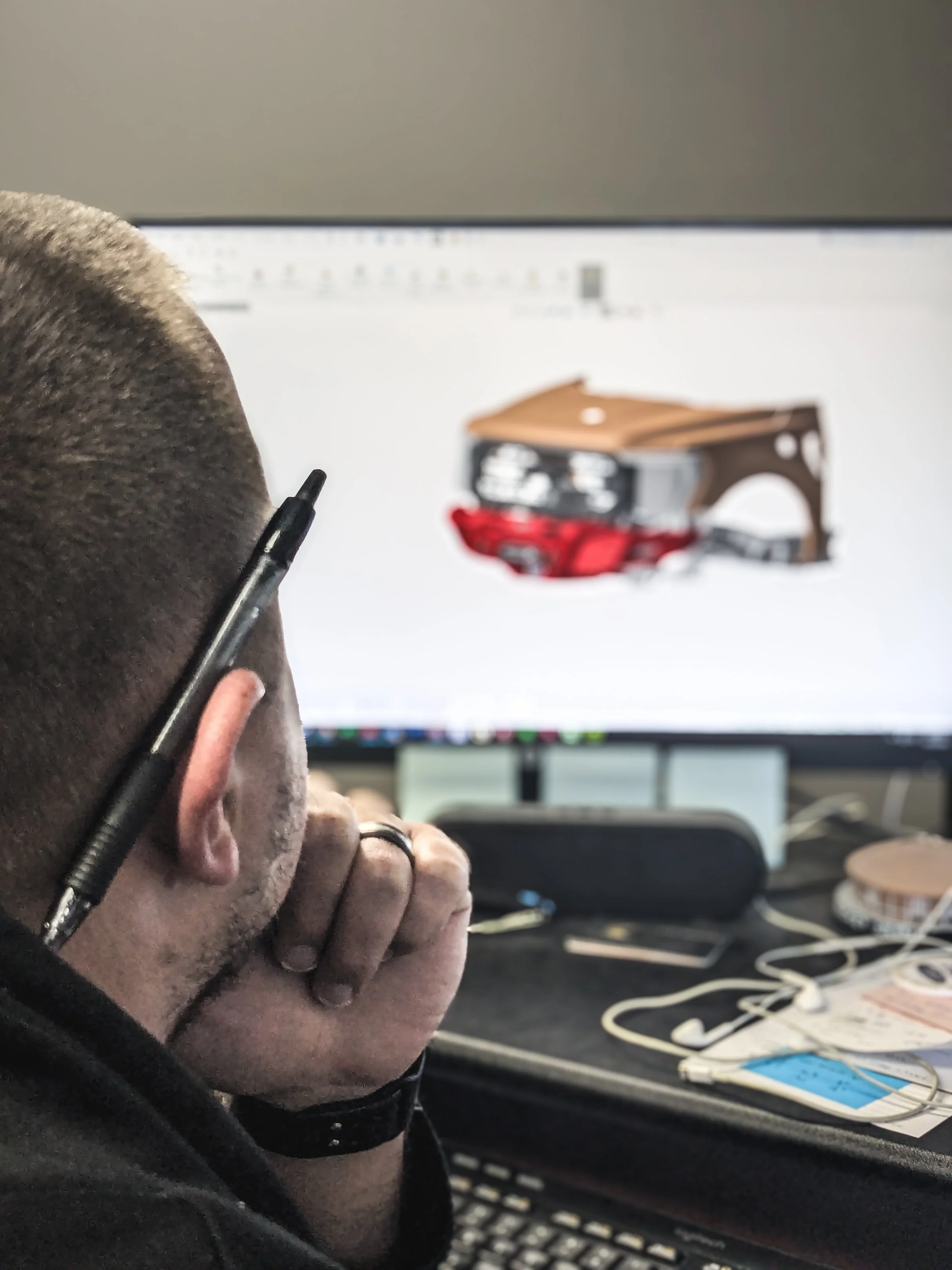 A person at a computer working with a CAD file