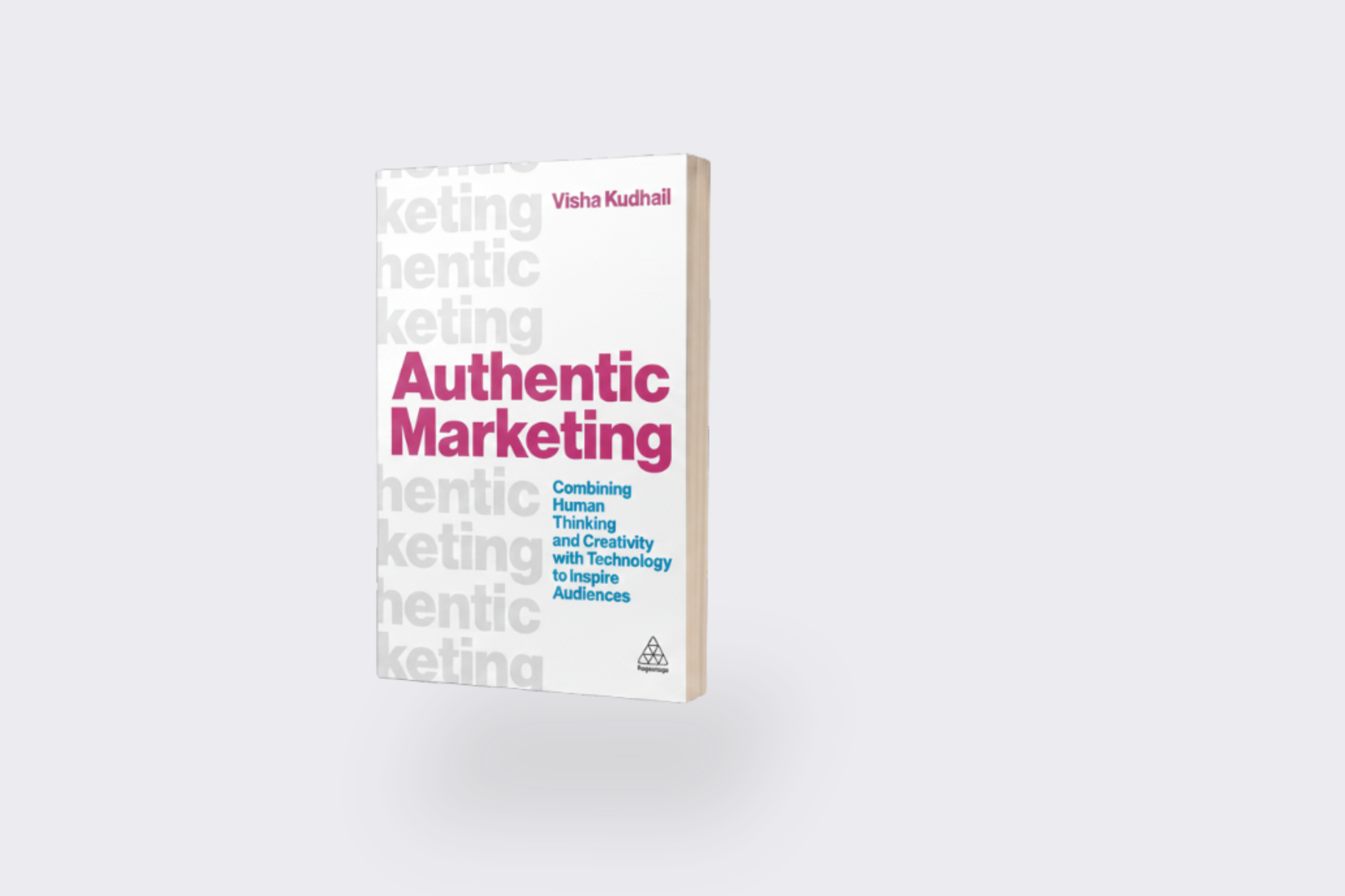Book titled 'Authentic Marketing' by Visha Kudhail, with a white cover featuring gray, pink, and blue text, standing upright against a plain gray background.