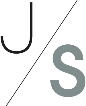 Stylized letters J and S separated by a diagonal line on a dark background.